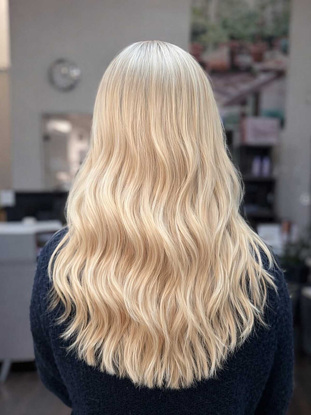 Long warm vanilla blonde waves with brighter ends