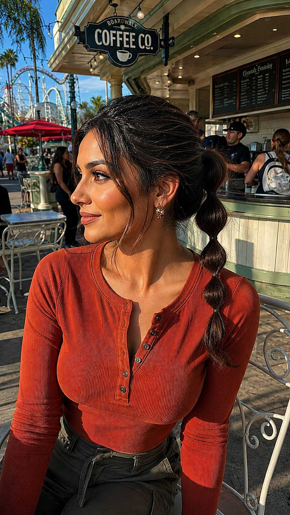 Dark brunette bubble braid ponytail with loose face-framing pieces