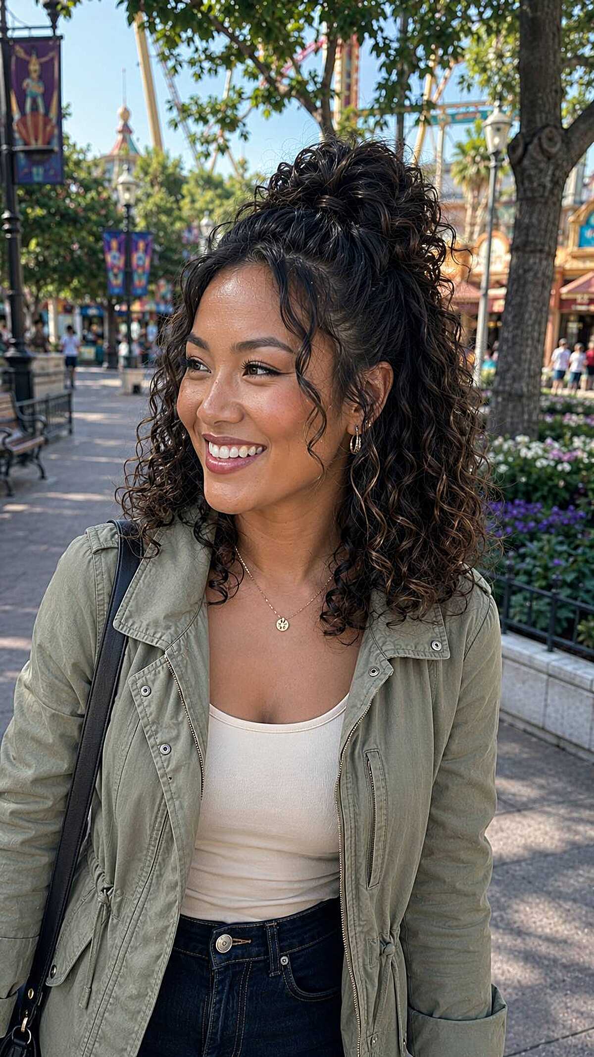 Curly dark hair in a high pineapple ponytail with loose curls