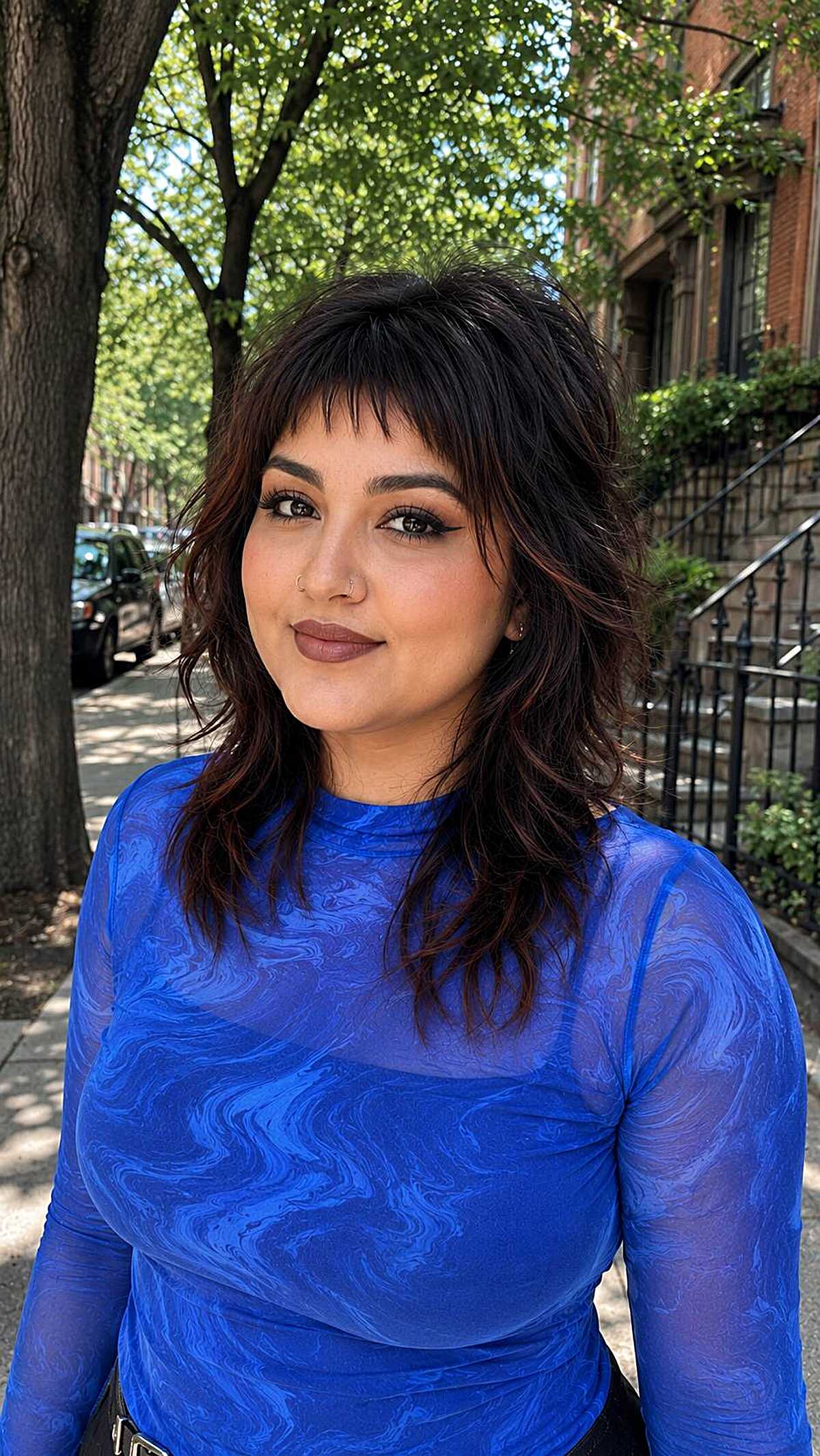 Dark shaggy wolf cut with short choppy bangs