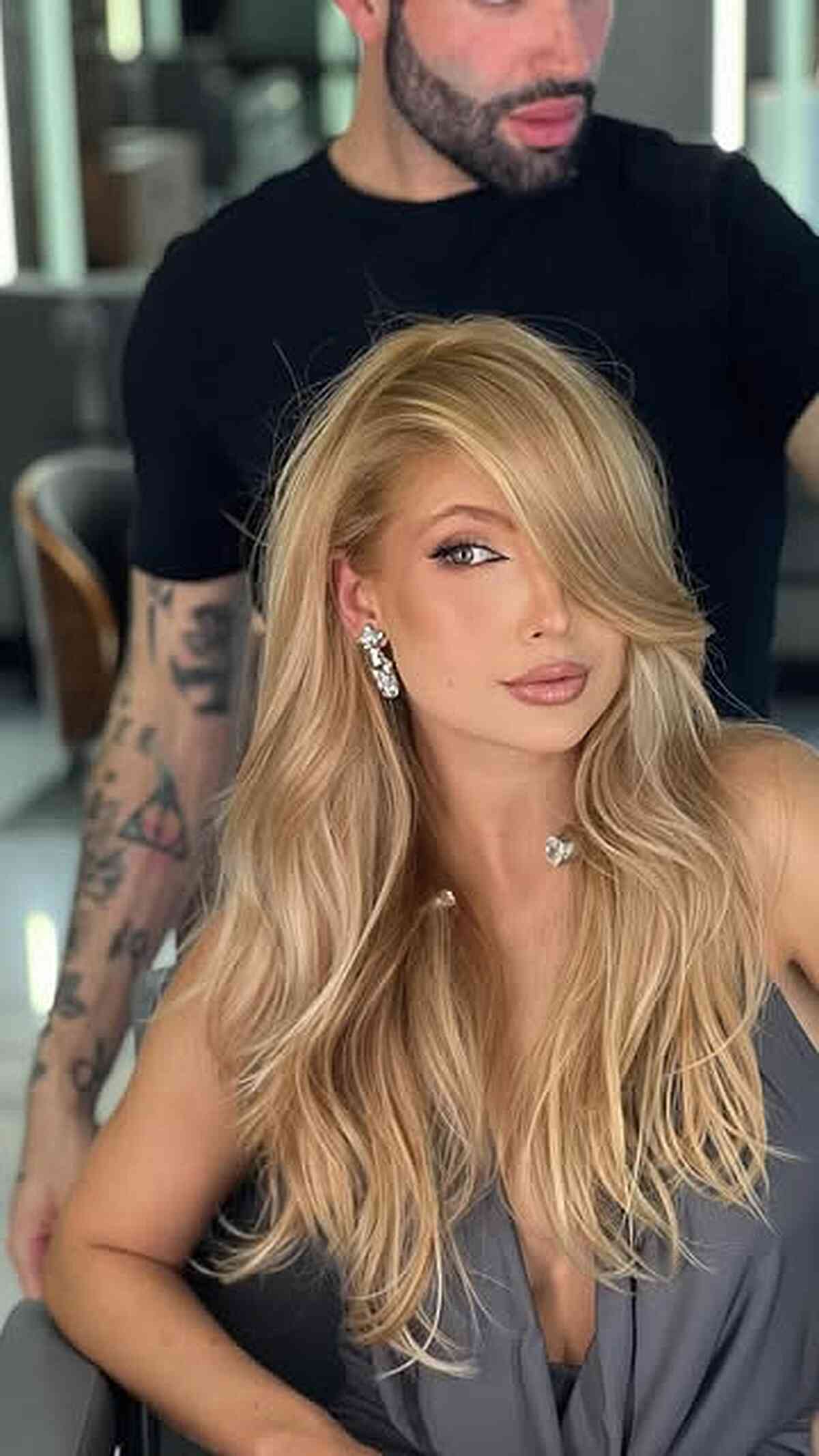 Face-Framing Butterfly Layers on Long Blonde Hair