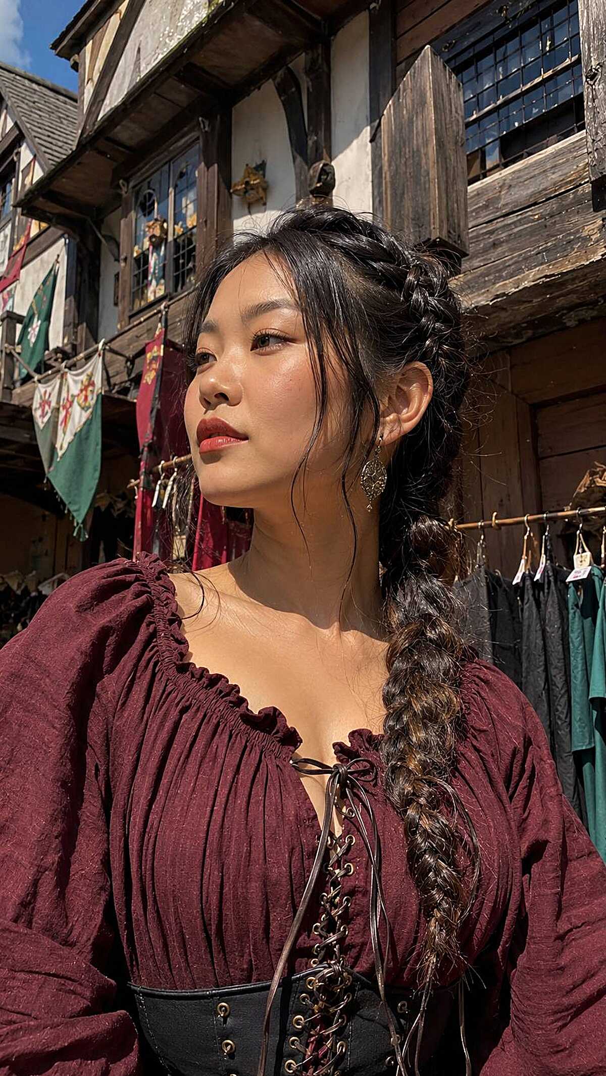 Long dark fishtail braid ponytail with face-framing pieces