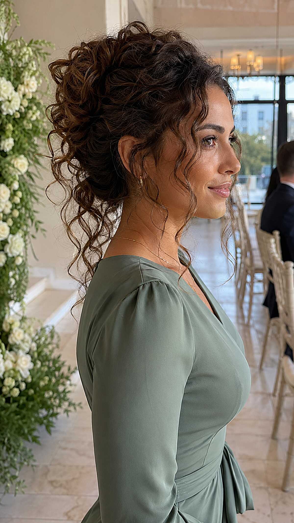 Gathered Curly Updo with Loose Tendrils at the Nape