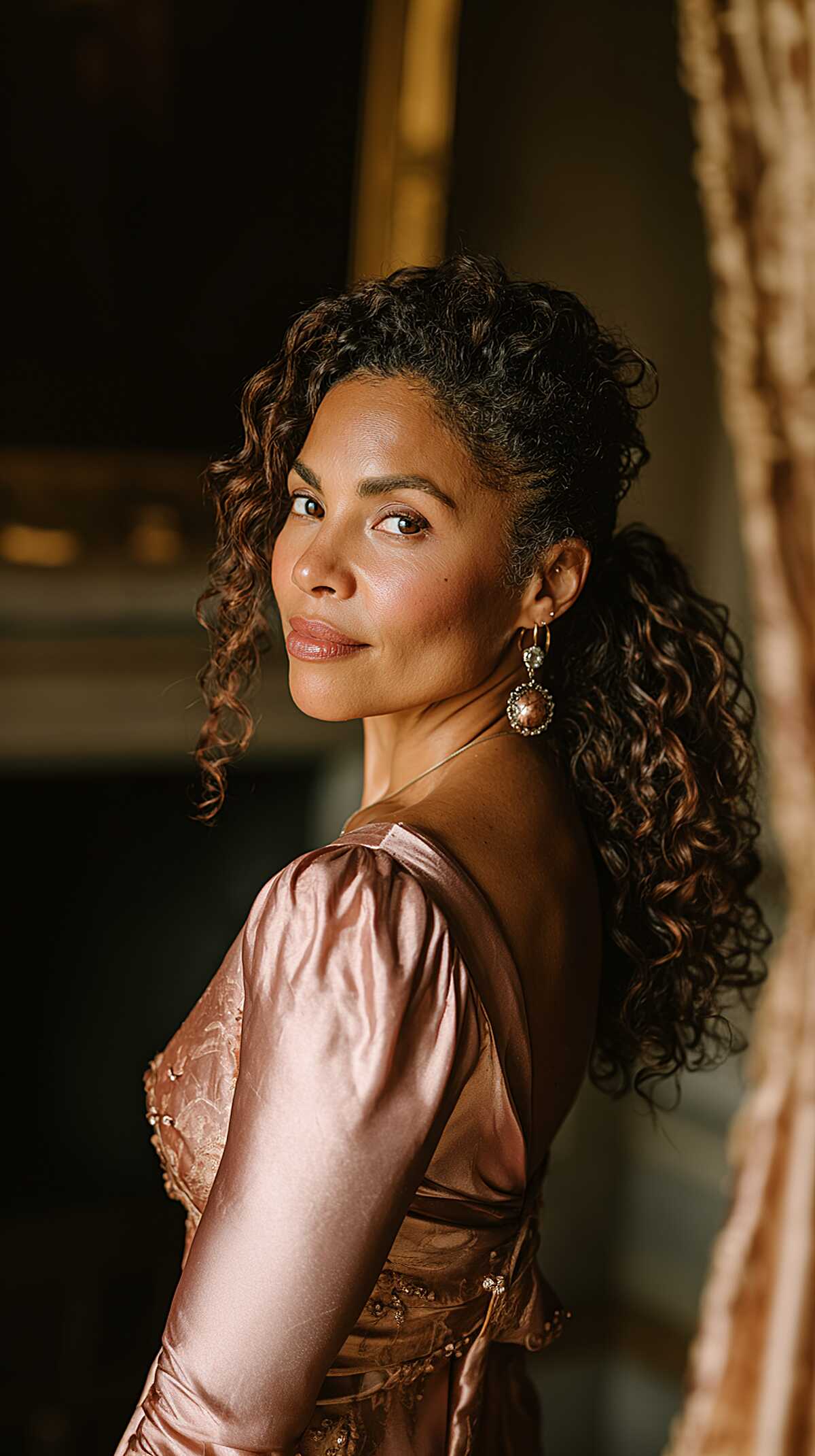 Low-Set Spiral Ponytail with Soft Curly Pieces at the Forehead