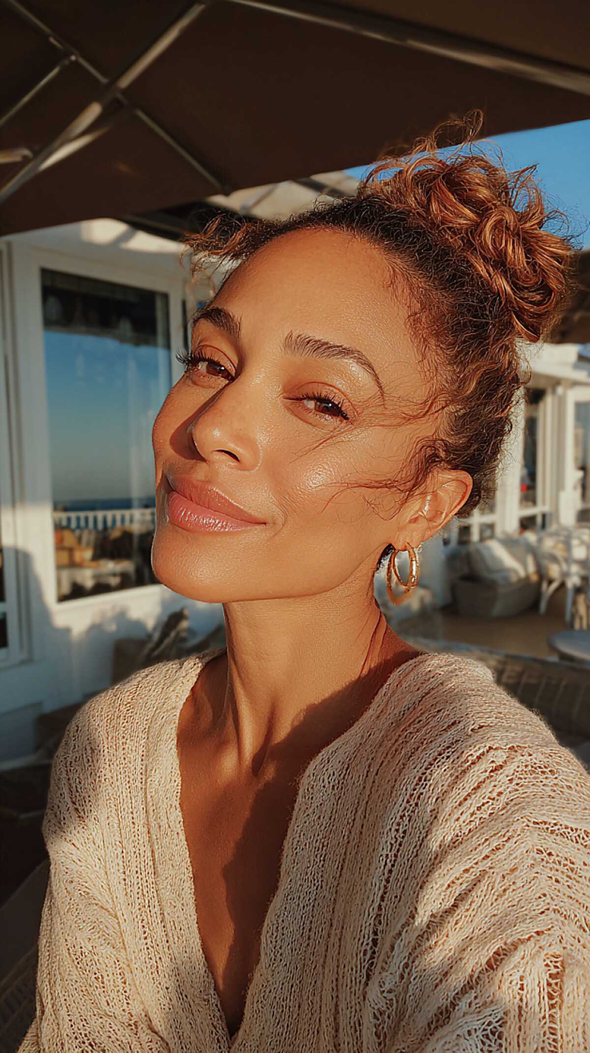 Piled Curly Topknot with Warm Copper Ends and Dark Roots
