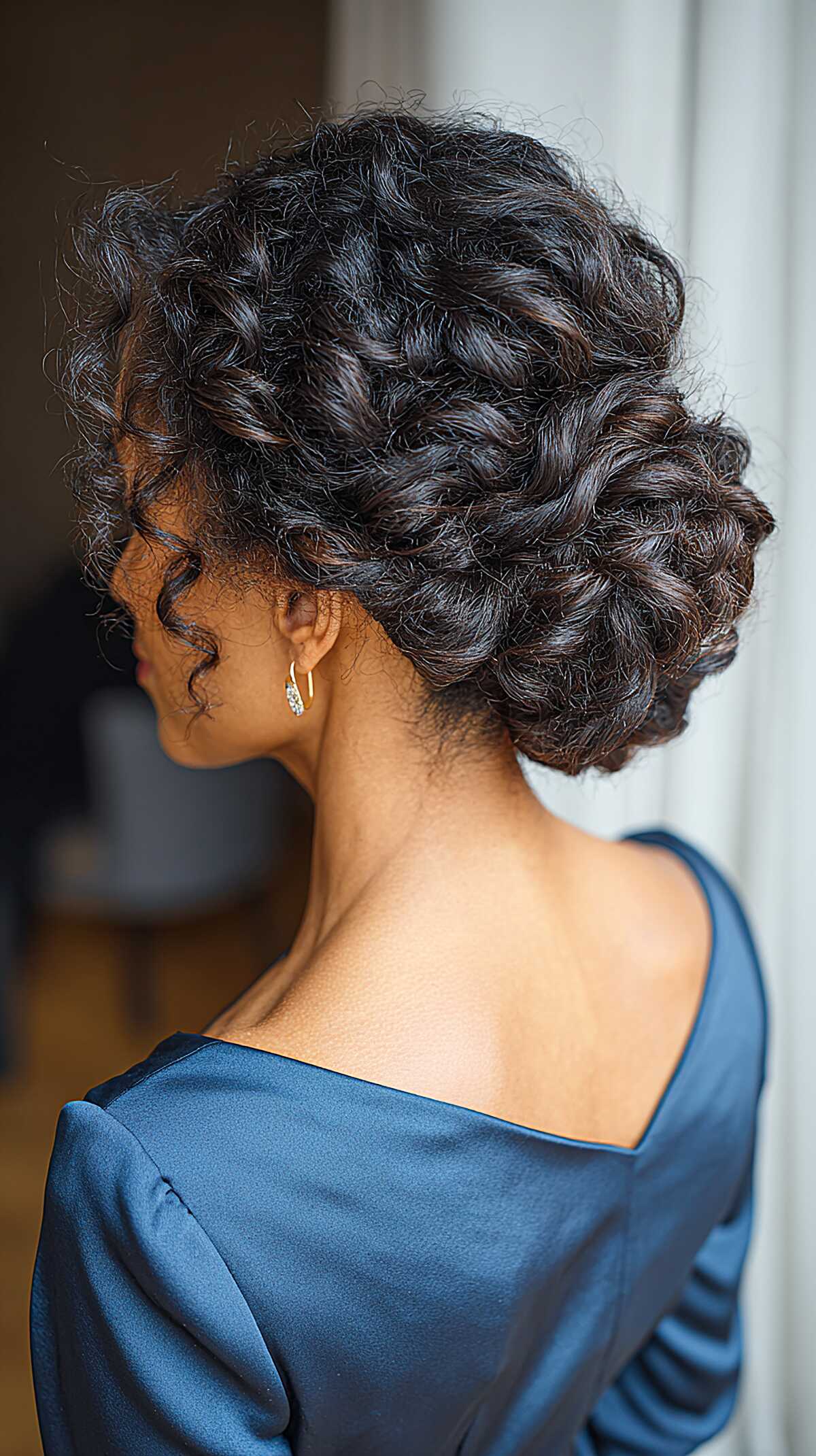 Rolled and Pinned Full Curl Updo with Natural Dark Texture