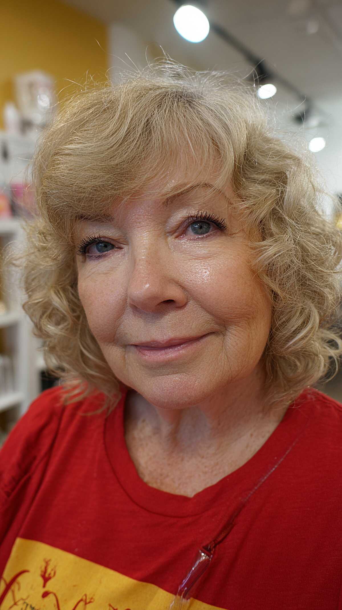 Curly blonde shaggy bob with short textured bangs
