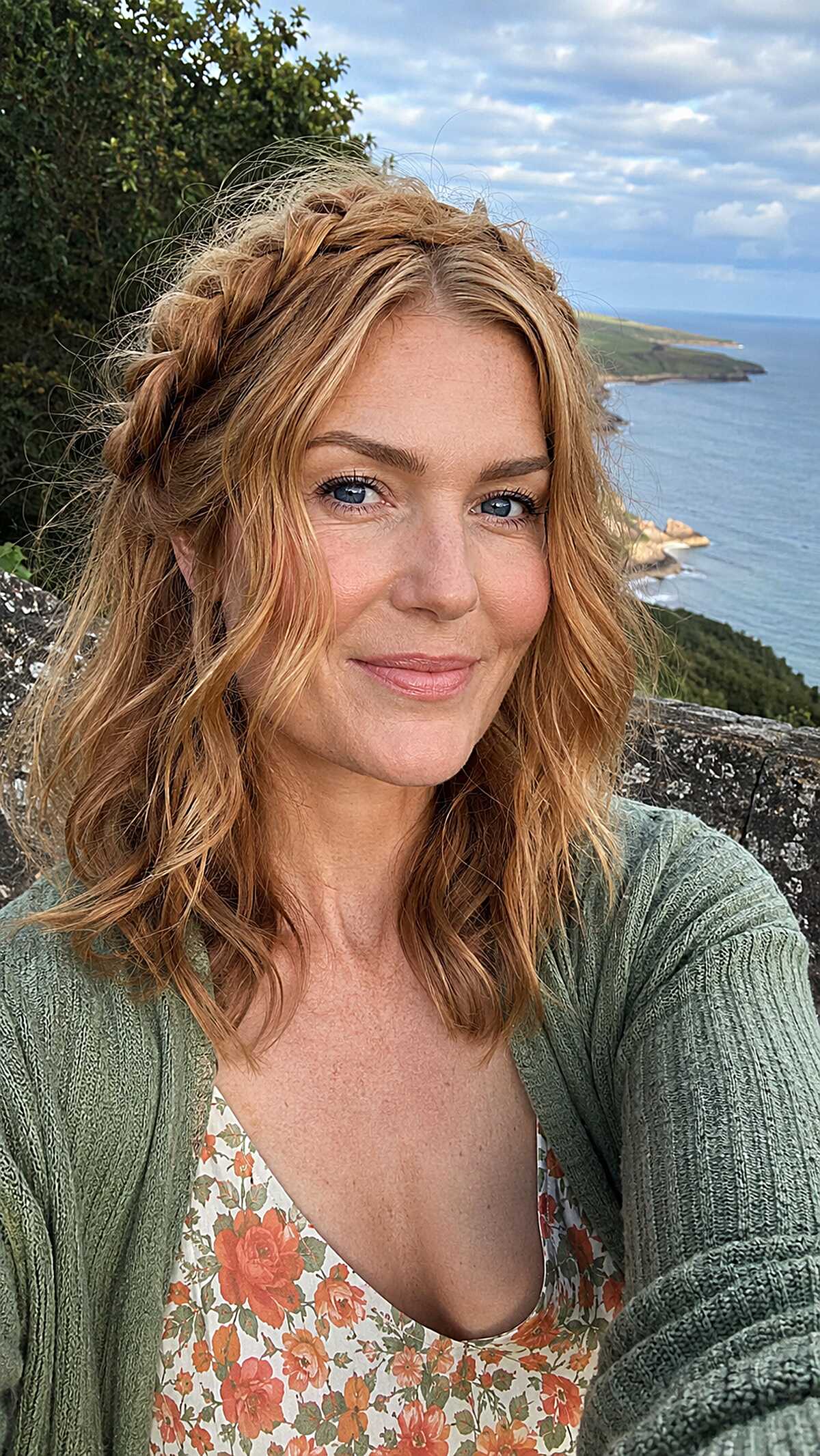 Small Crown Braid Tucked into Windblown Strawberry Blonde Waves