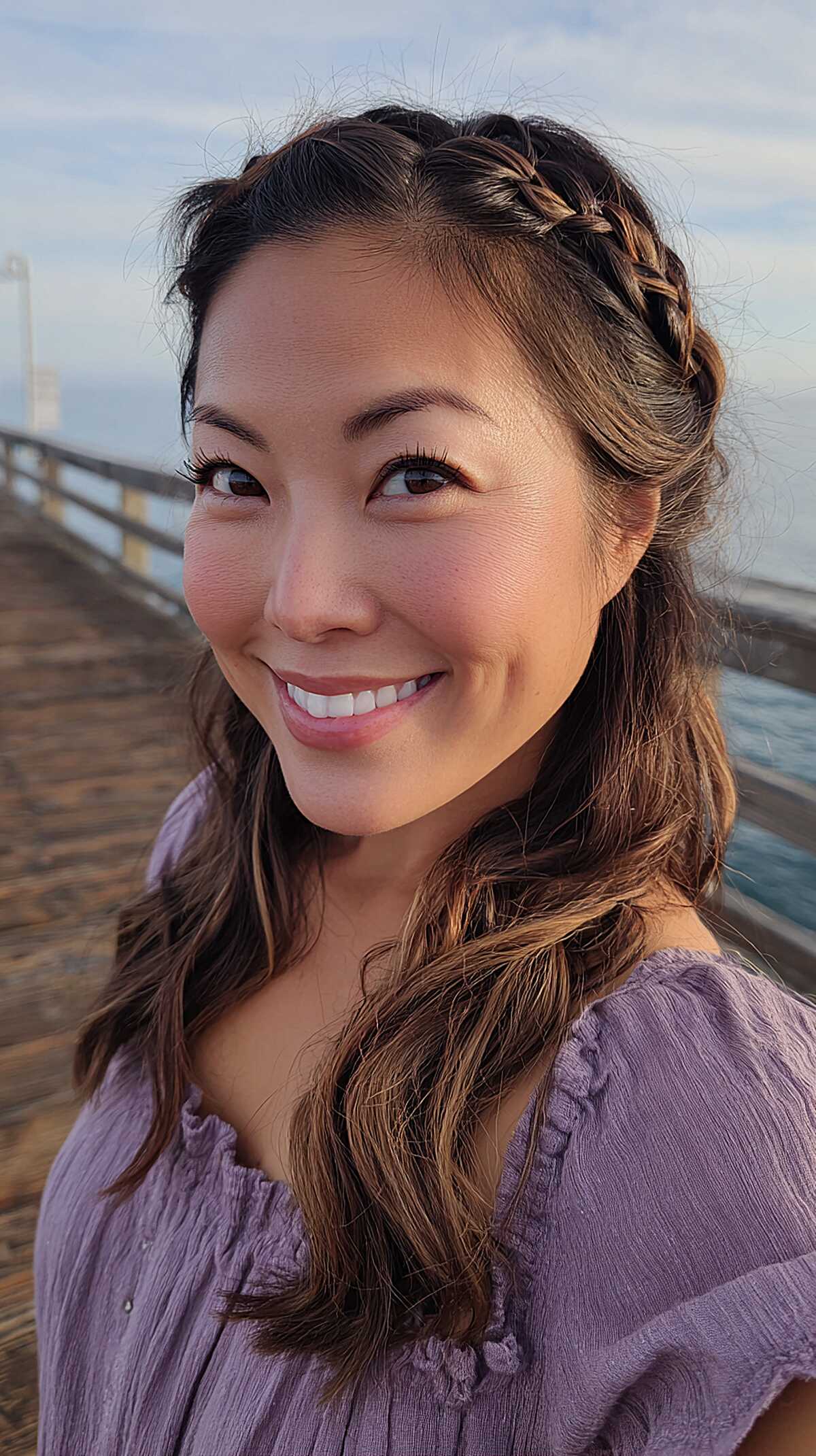 Thin Crown Braid Headband with Warm Brunette Waves Swept to One Side