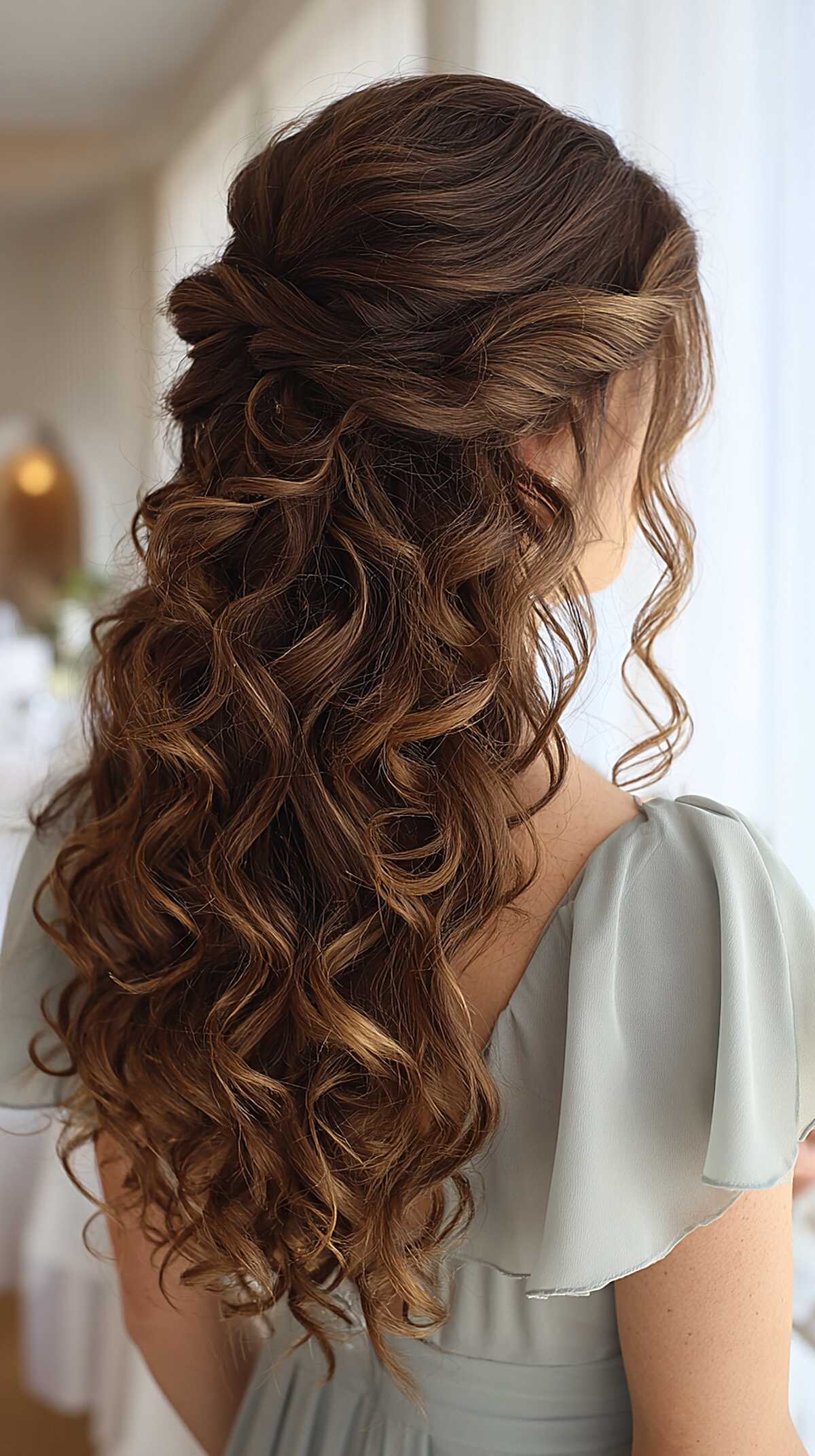 Twisted Half-Up Waterfall with Warm Brunette Spirals Past the Shoulders