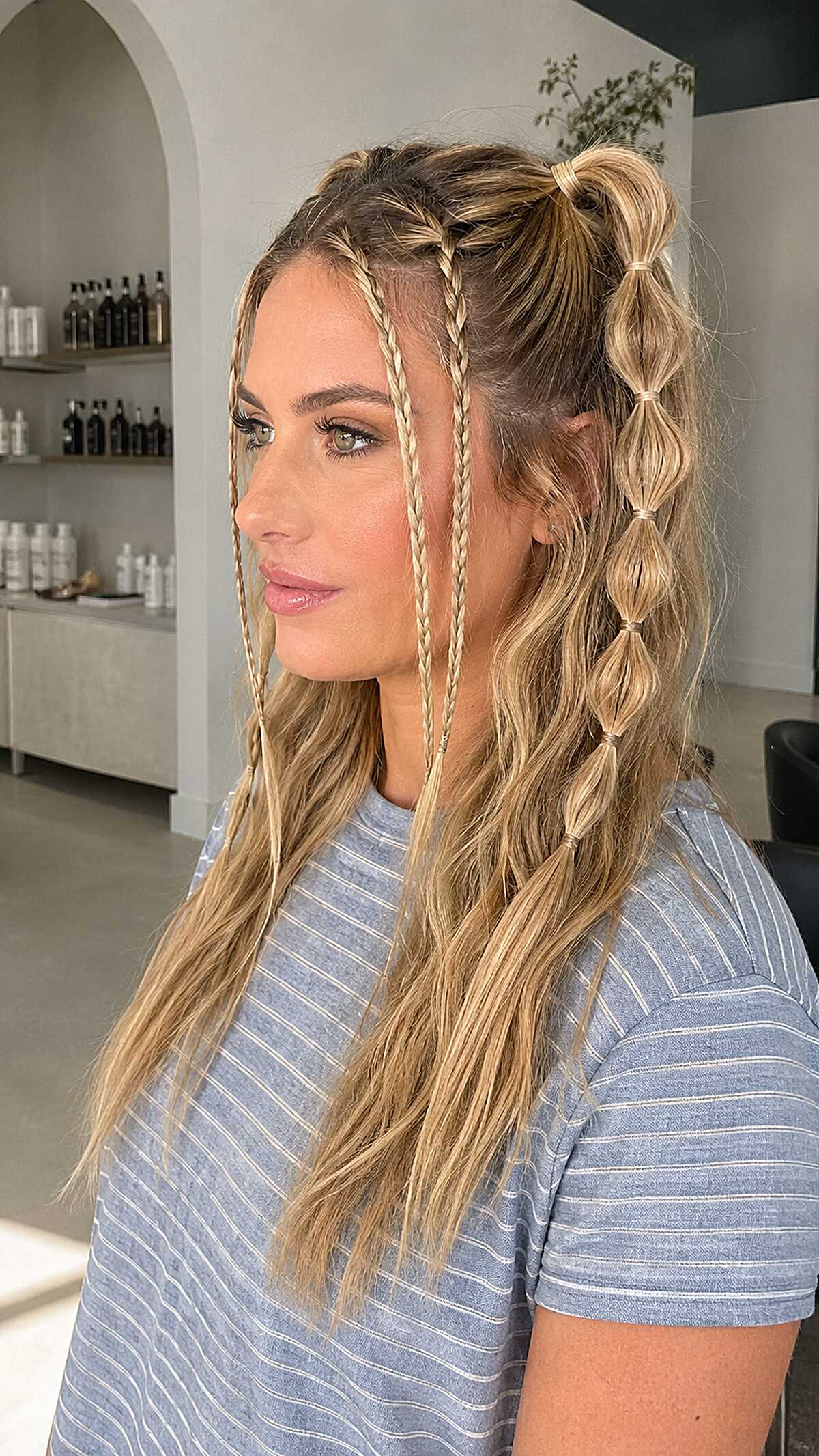 Bubble braid ponytail with thin face-framing braids, blonde