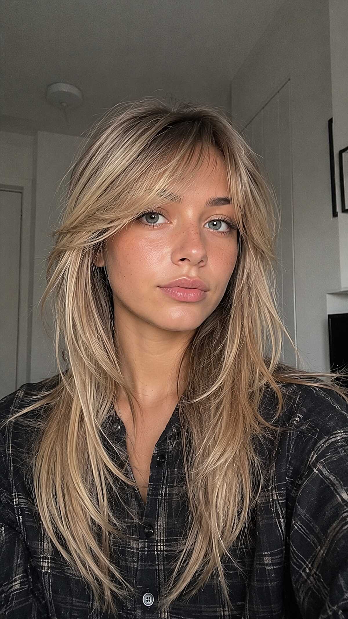 Golden blonde long shag with soft feathered bangs