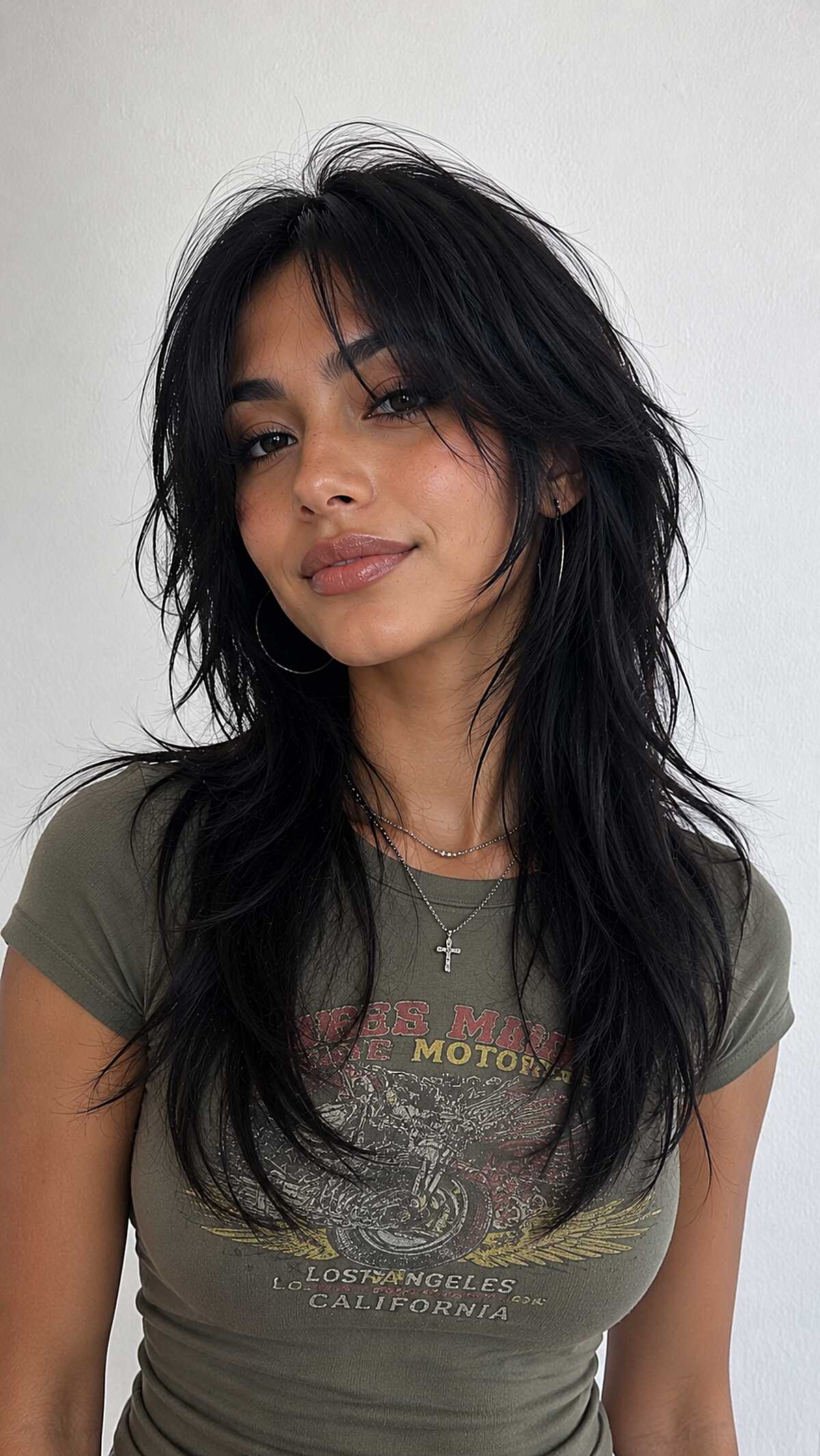 Jet black long wolf cut with soft razored bangs