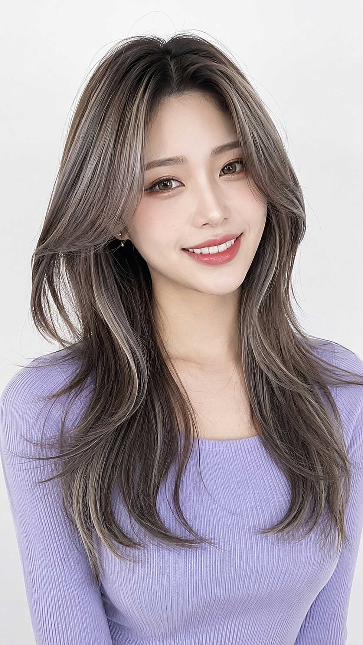 Ash brown long layers with a polished Korean blowout