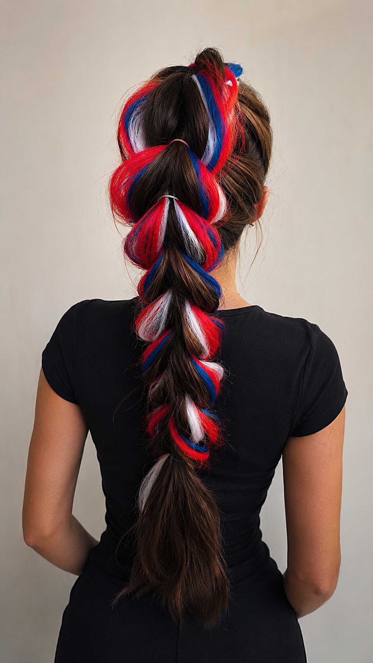 Pulled Pancake Braid with Red White and Blue Braiding Hair Woven Through