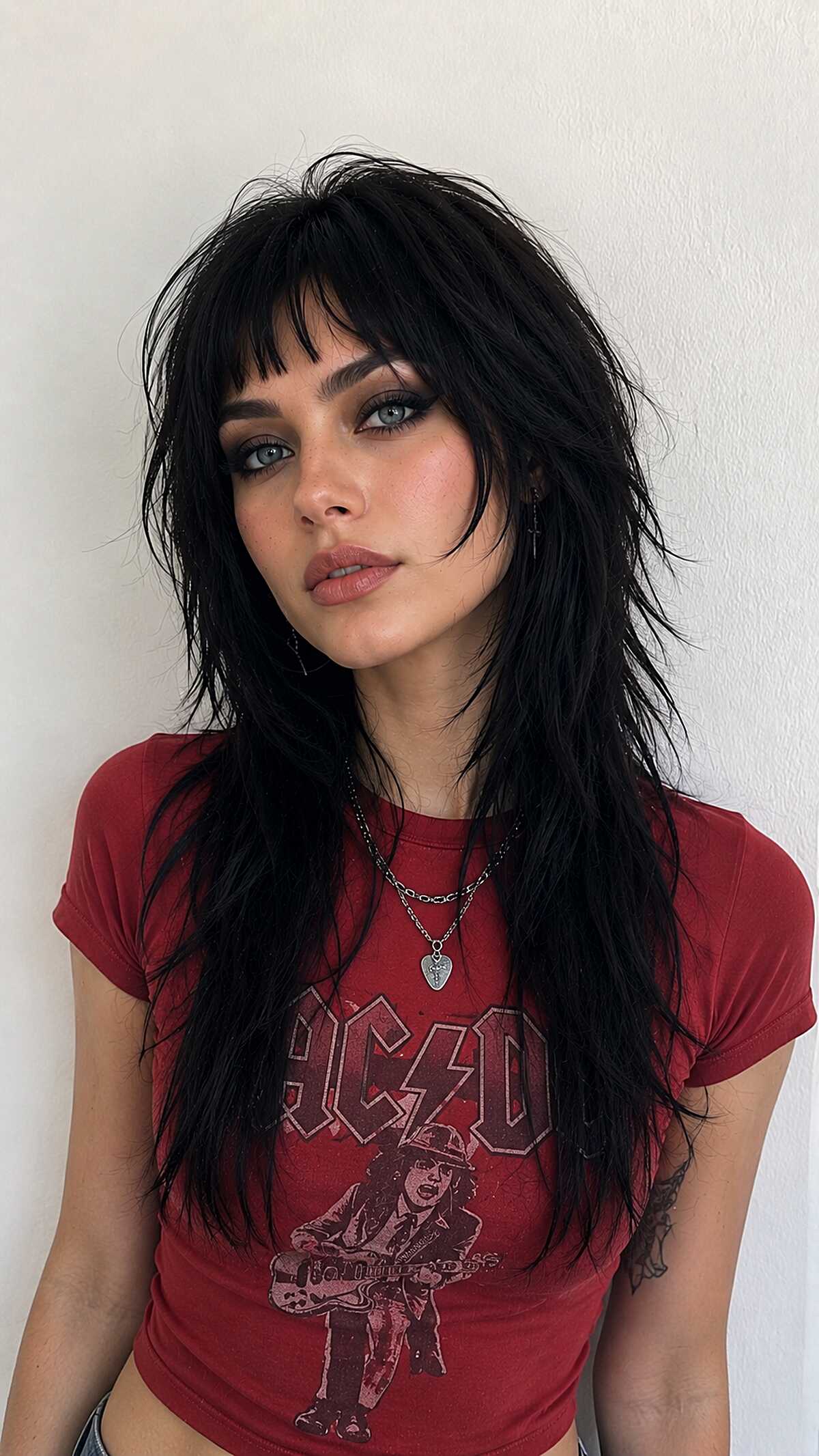 Black rock-inspired long shag with heavy bangs