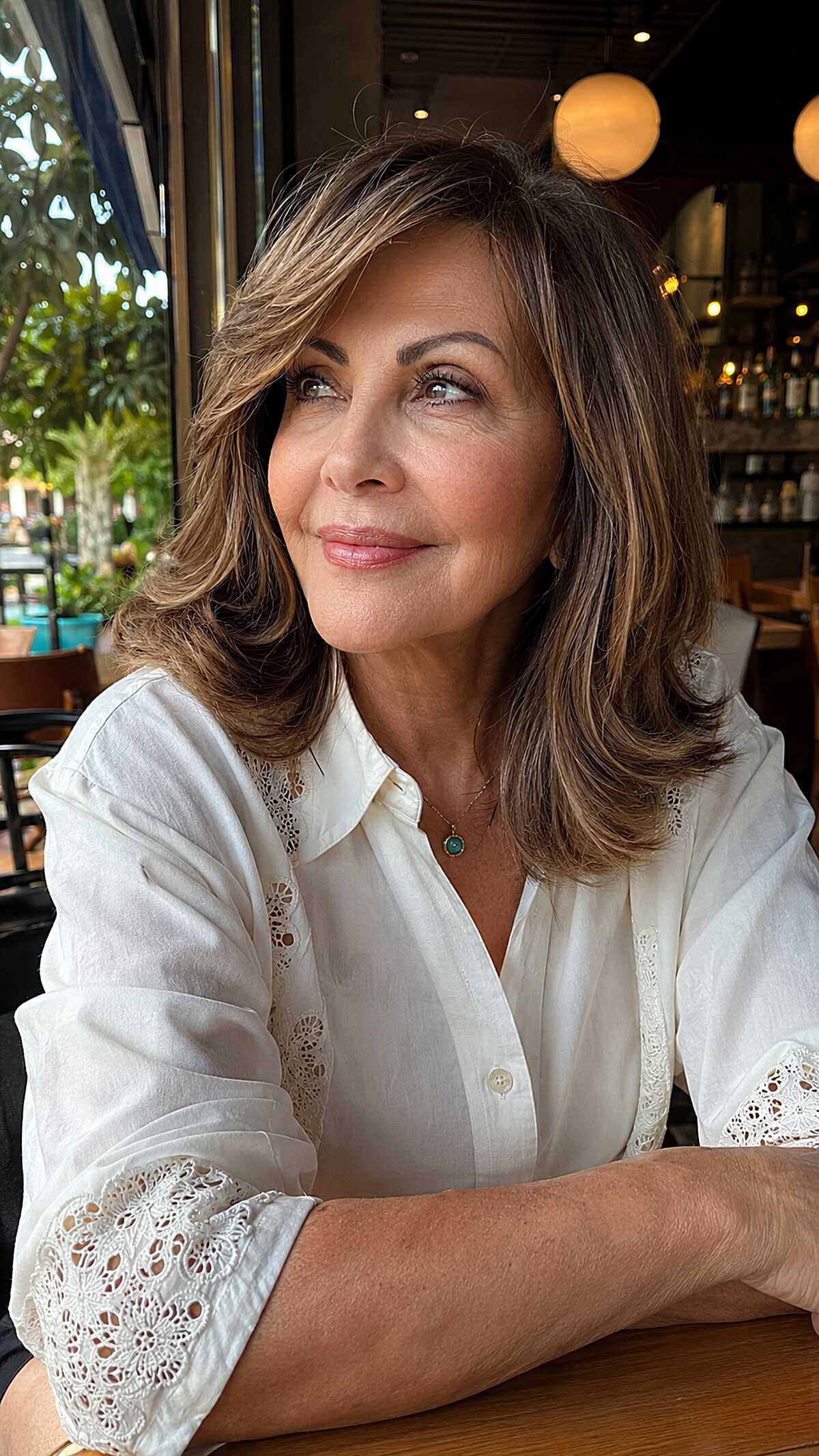 Brunette shoulder-length layers with curtain face framing