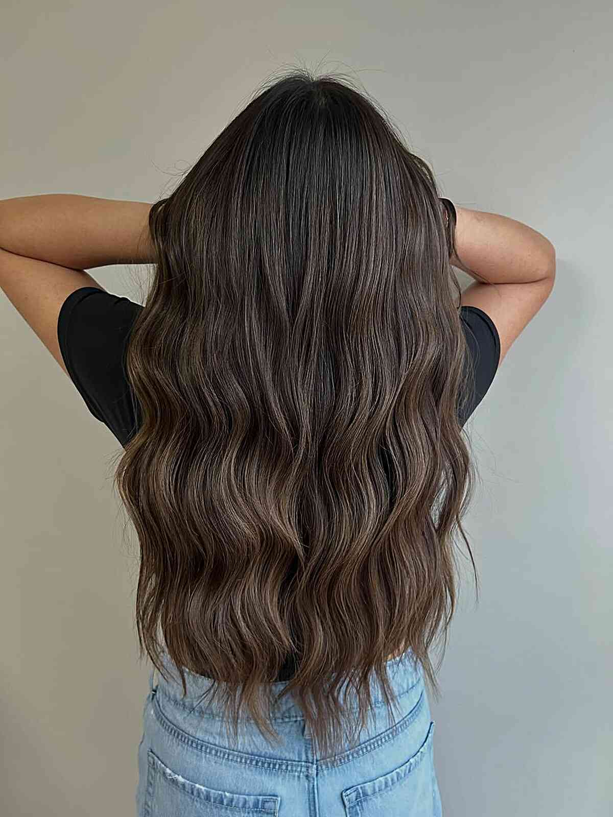 Wavy Dark Brown Hair with Subtle Highlights