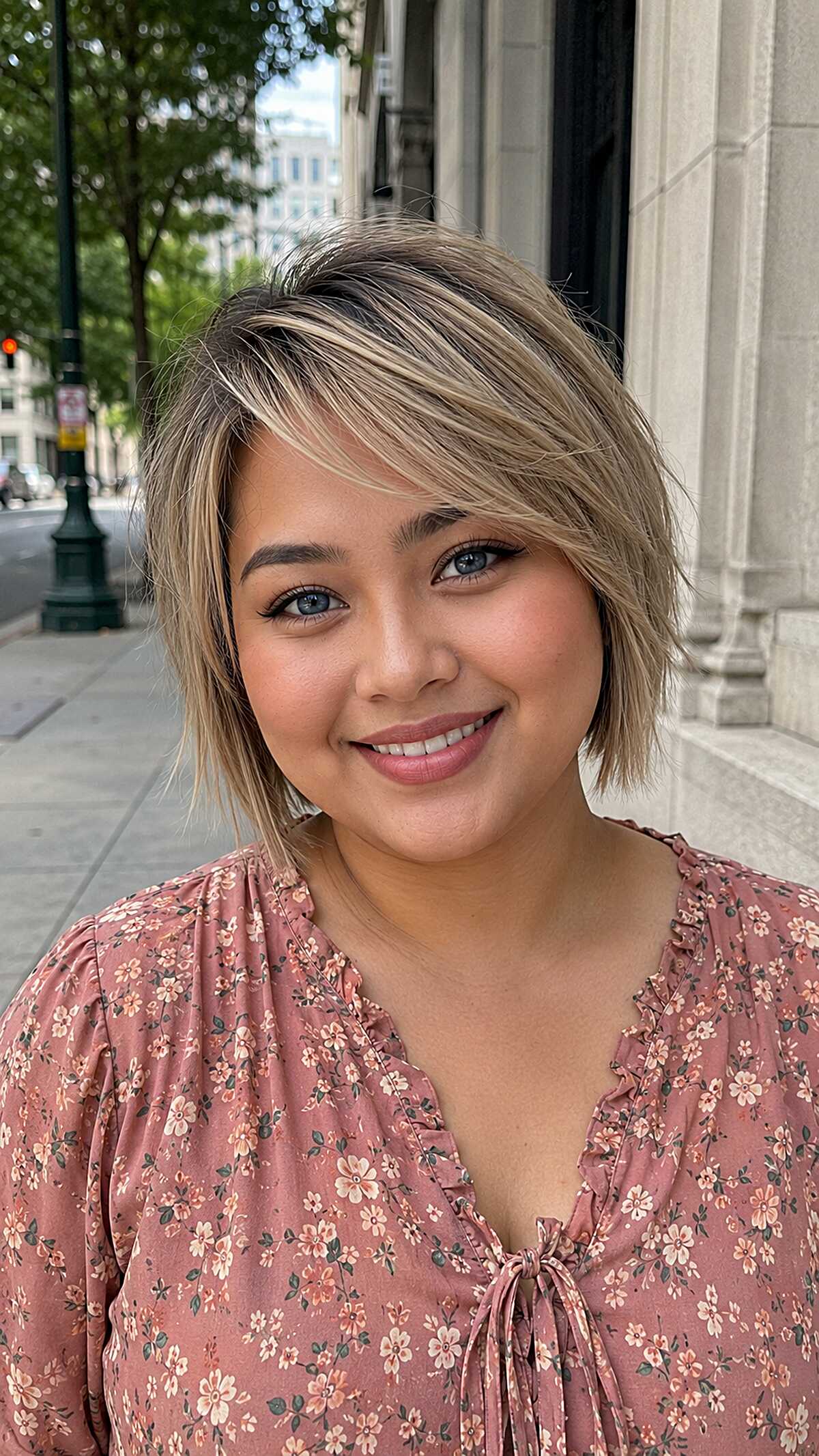 Ash blonde shaggy pixie bob with long side-swept fringe