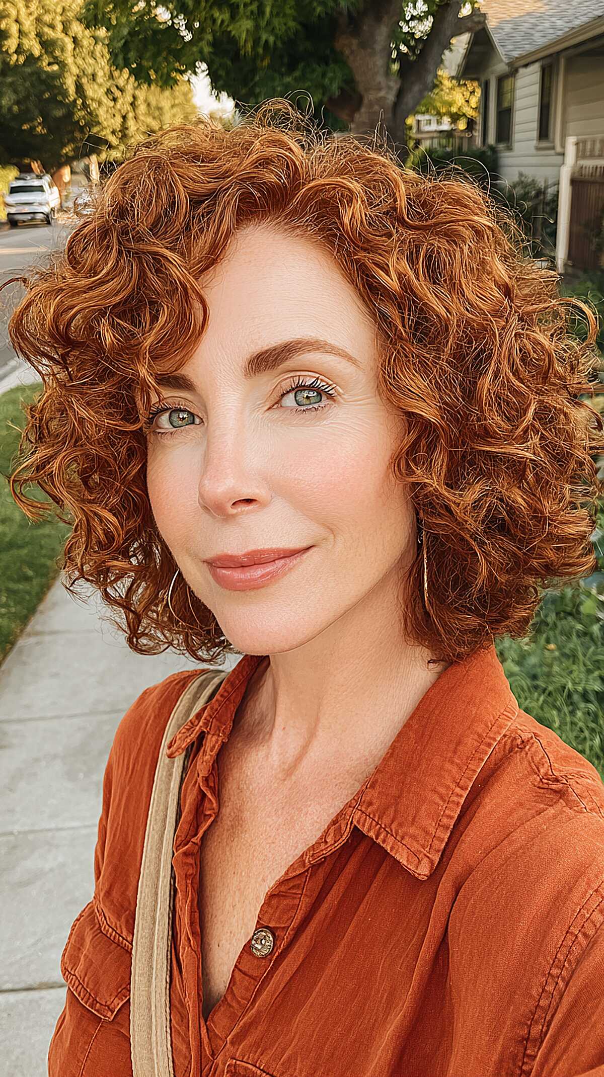 Copper Curly Bob with Warm Golden Dimension