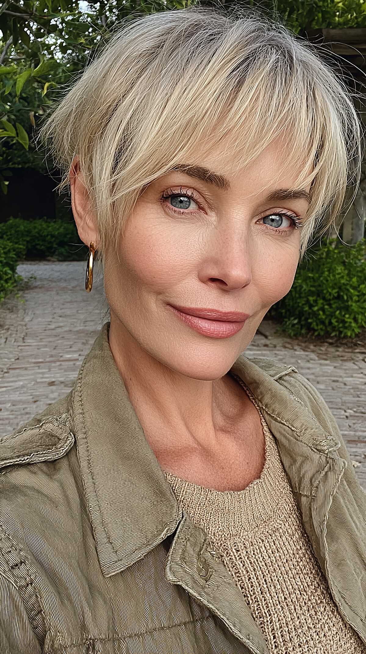 Icy Platinum Pixie with Razor-Cut Fringe and Natural Root Shadow