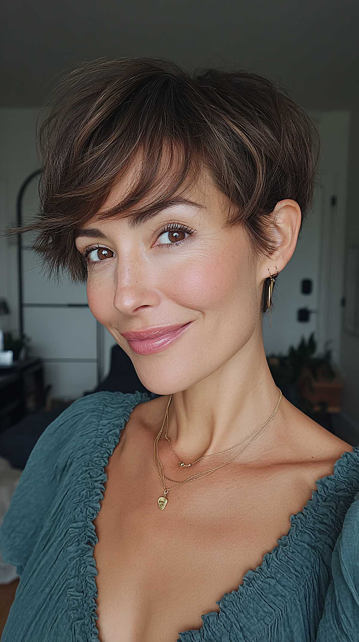 Soft Brunette Pixie with Feathered Sideburns and Tousled Top