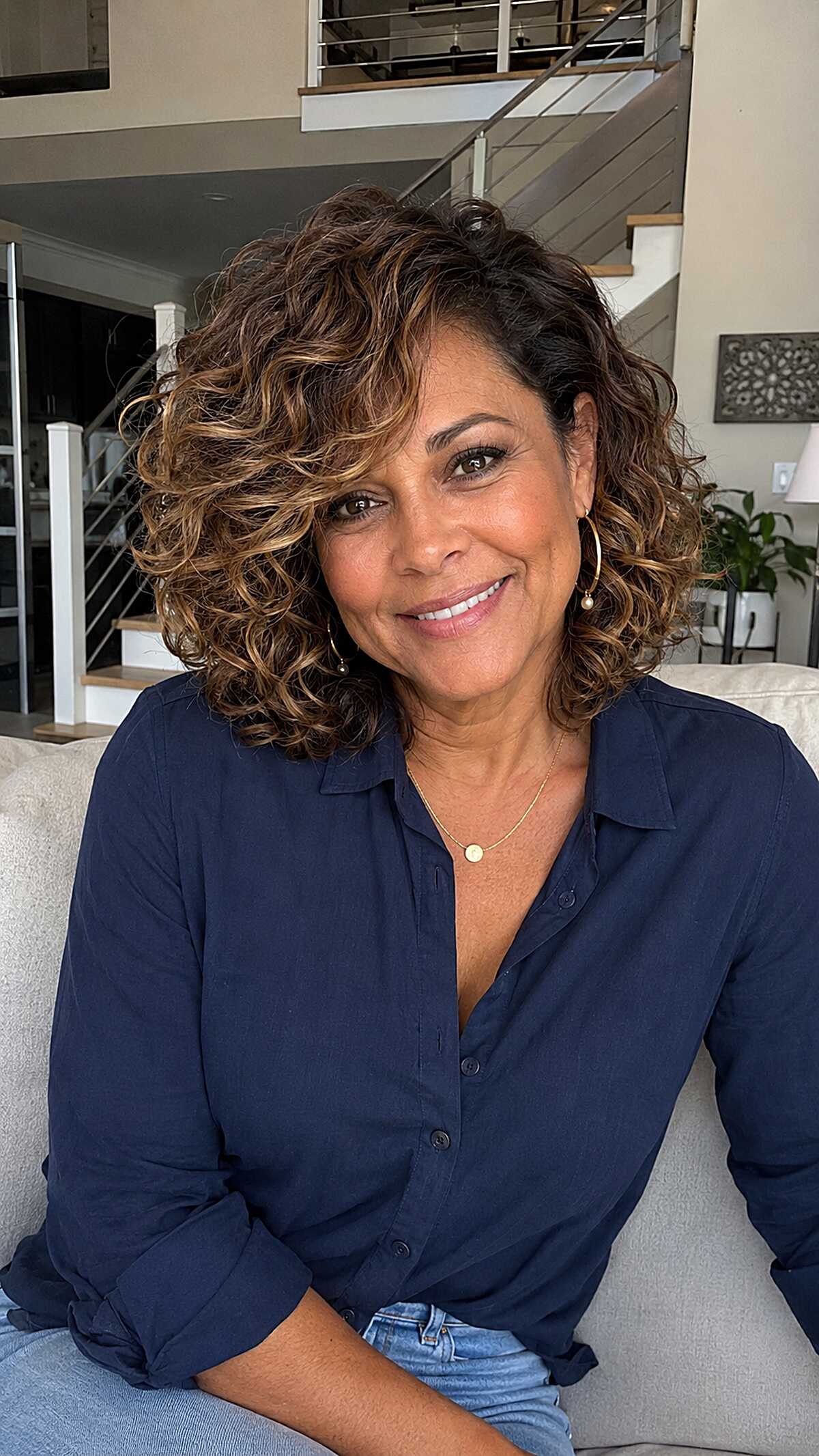 Warm Bronze Highlights on a Full Curly Bob
