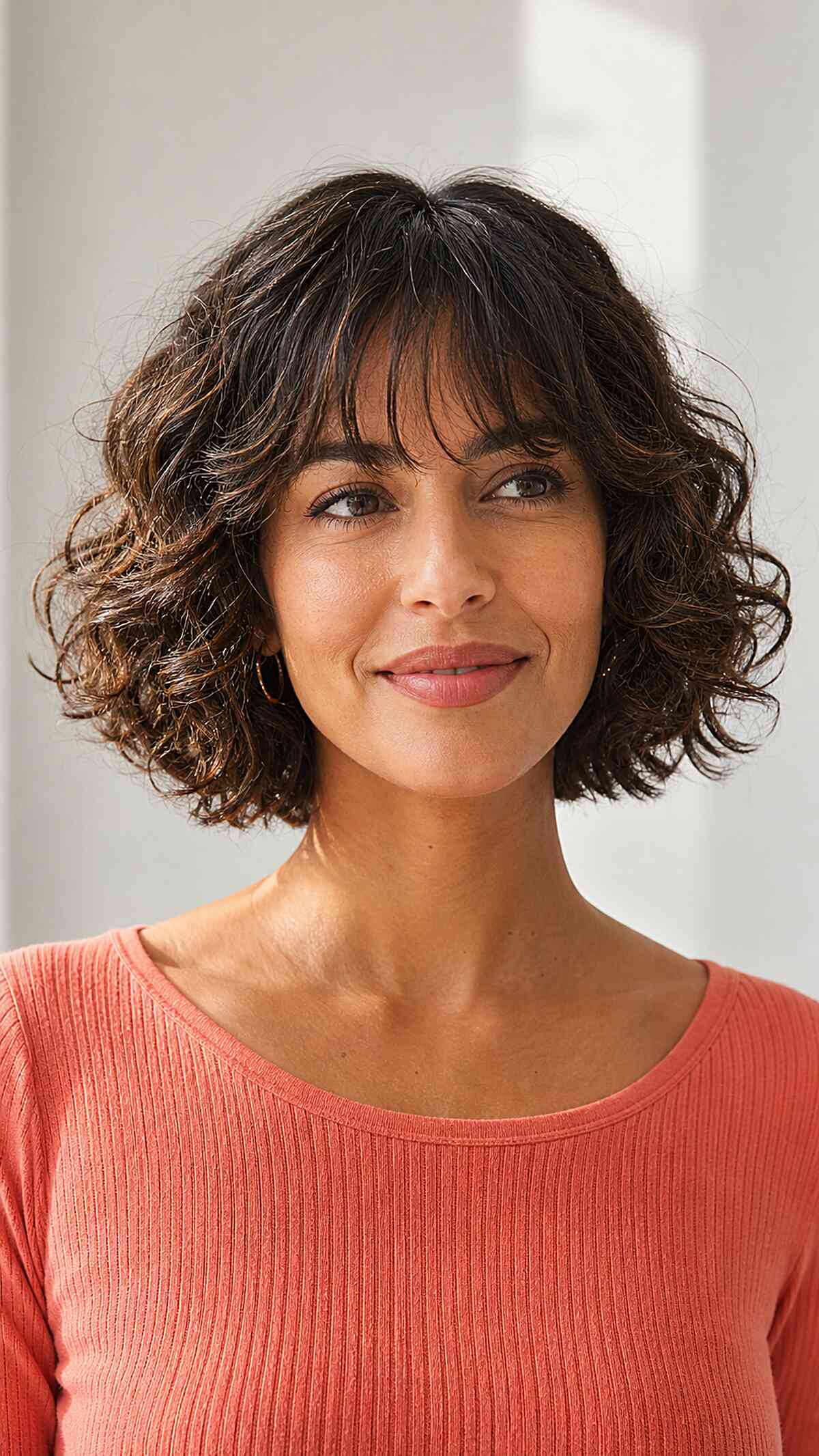 Playful Short Curly Hair with Bangs