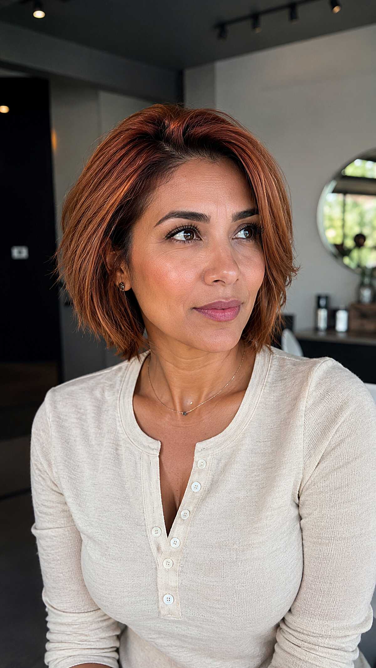 Blunt Copper Bob with Warm Ribbon Highlights on Olive Skin