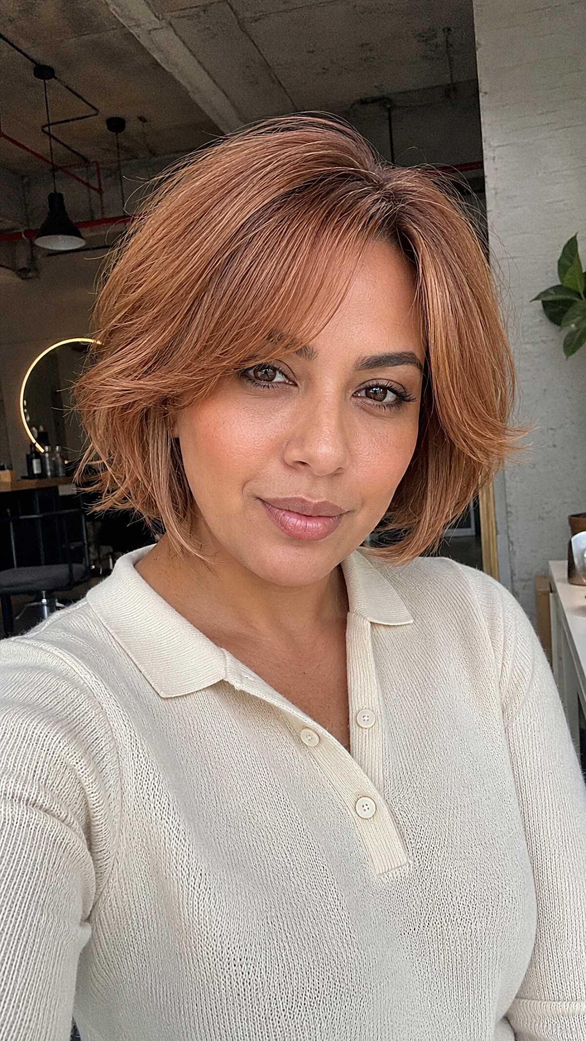 Chin-Length Copper Bob with Soft Fringe on Medium-Warm Skin