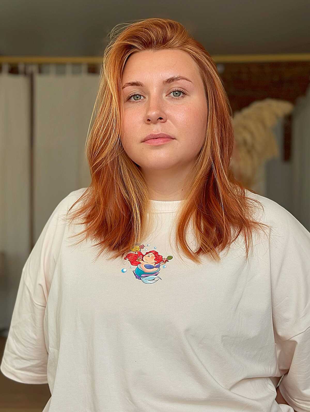 Mid-Length Light Copper with a Soft Natural Root on Fair, Cool-Toned Skin