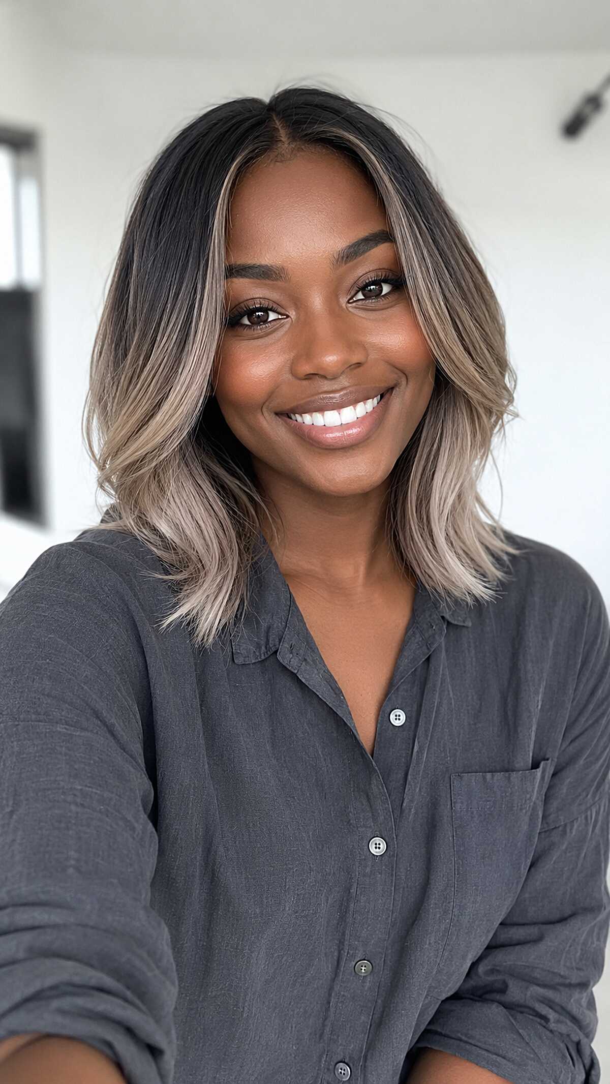 Ash Blonde Balayage Lob with Bold Face Framing on Deep Brown Skin