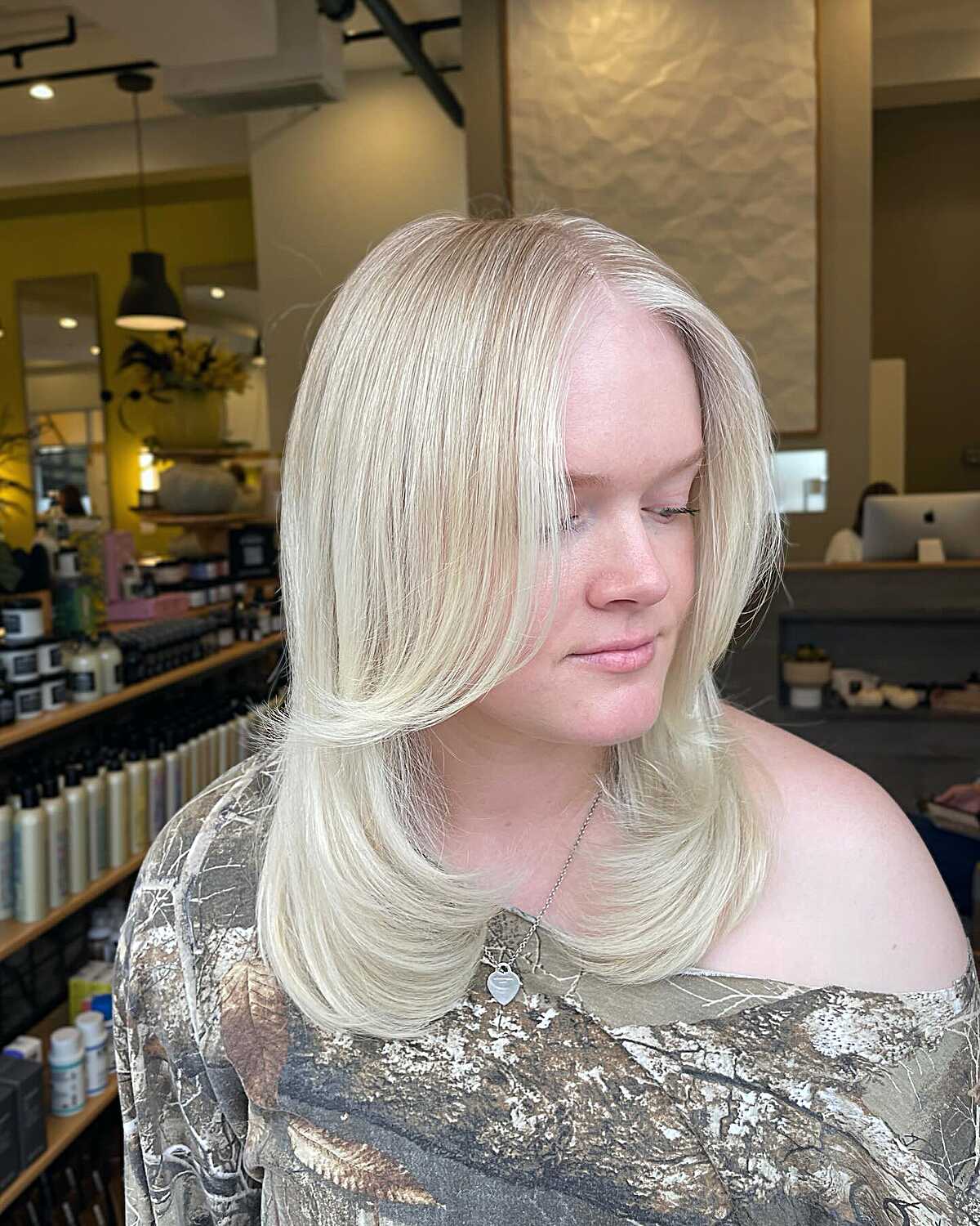 Icy platinum blonde shoulder-length layered hair