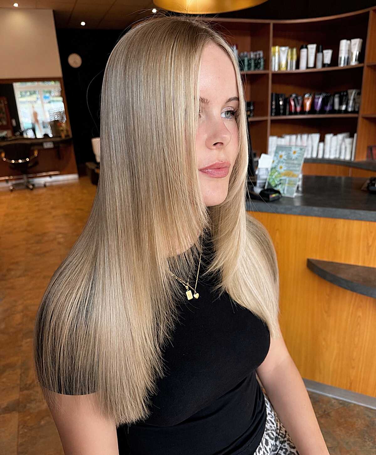 Long sleek dark blonde hair with clean layered lines