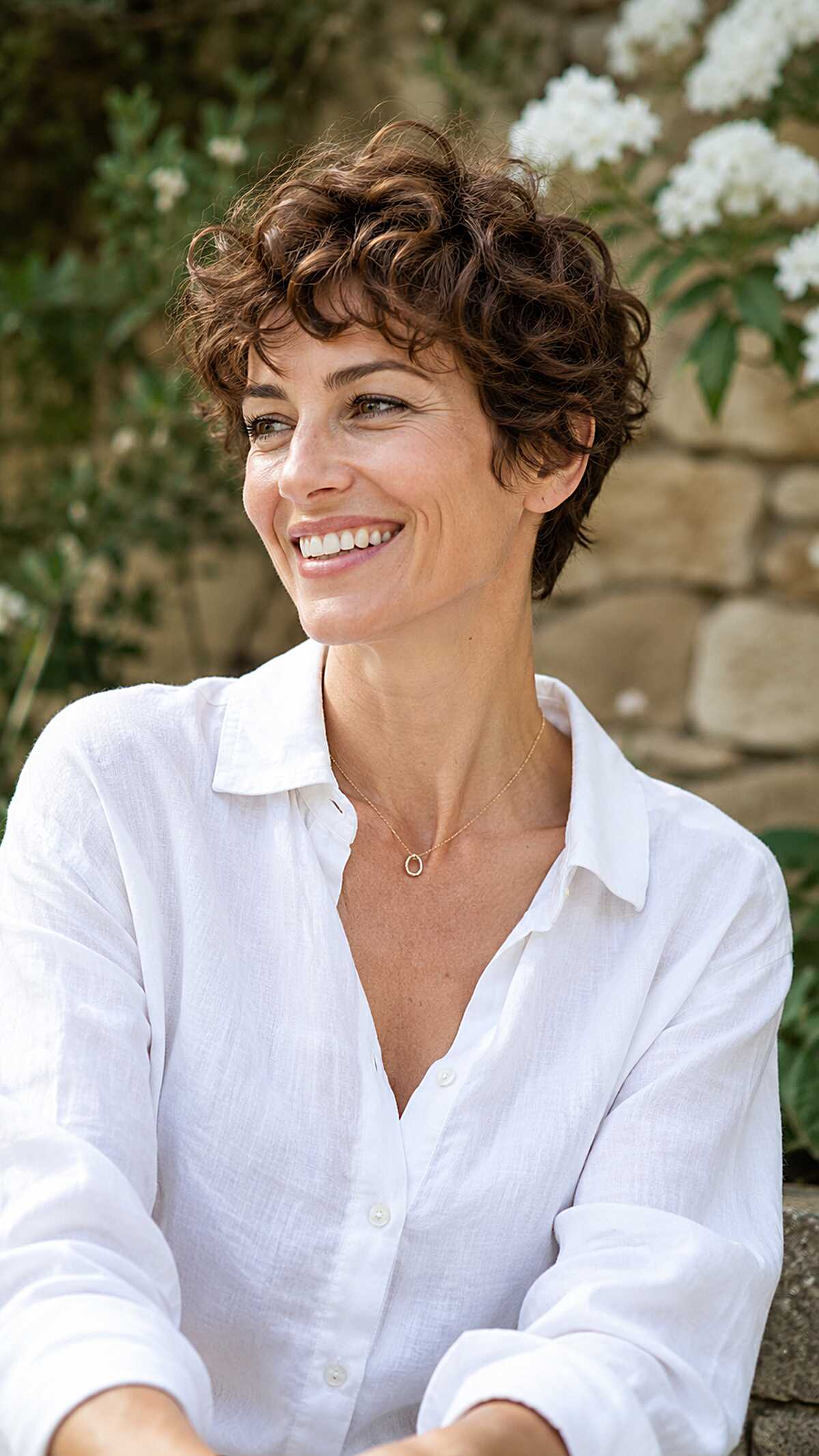 Tousled Brunette Curly Pixie with Soft Fringe