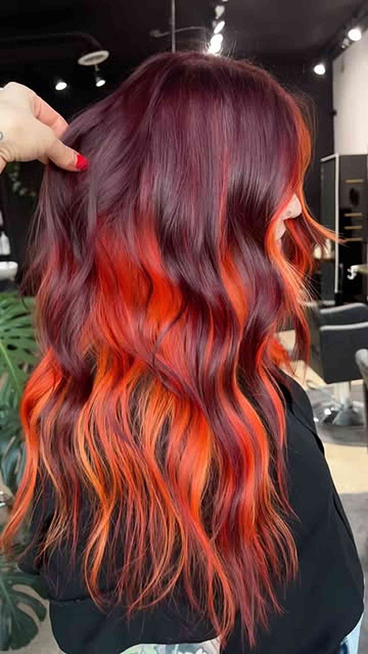 Bold Dark Burgundy Waves with Orange Peekaboo Highlights