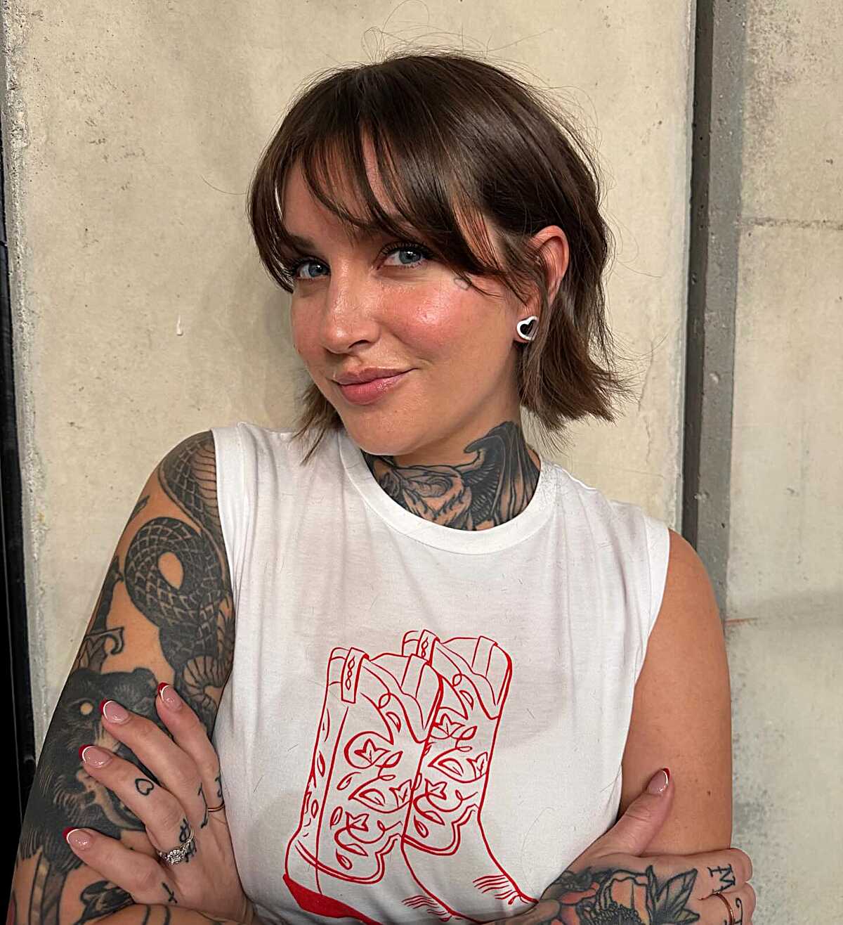 Short choppy brunette bob with curtain bangs