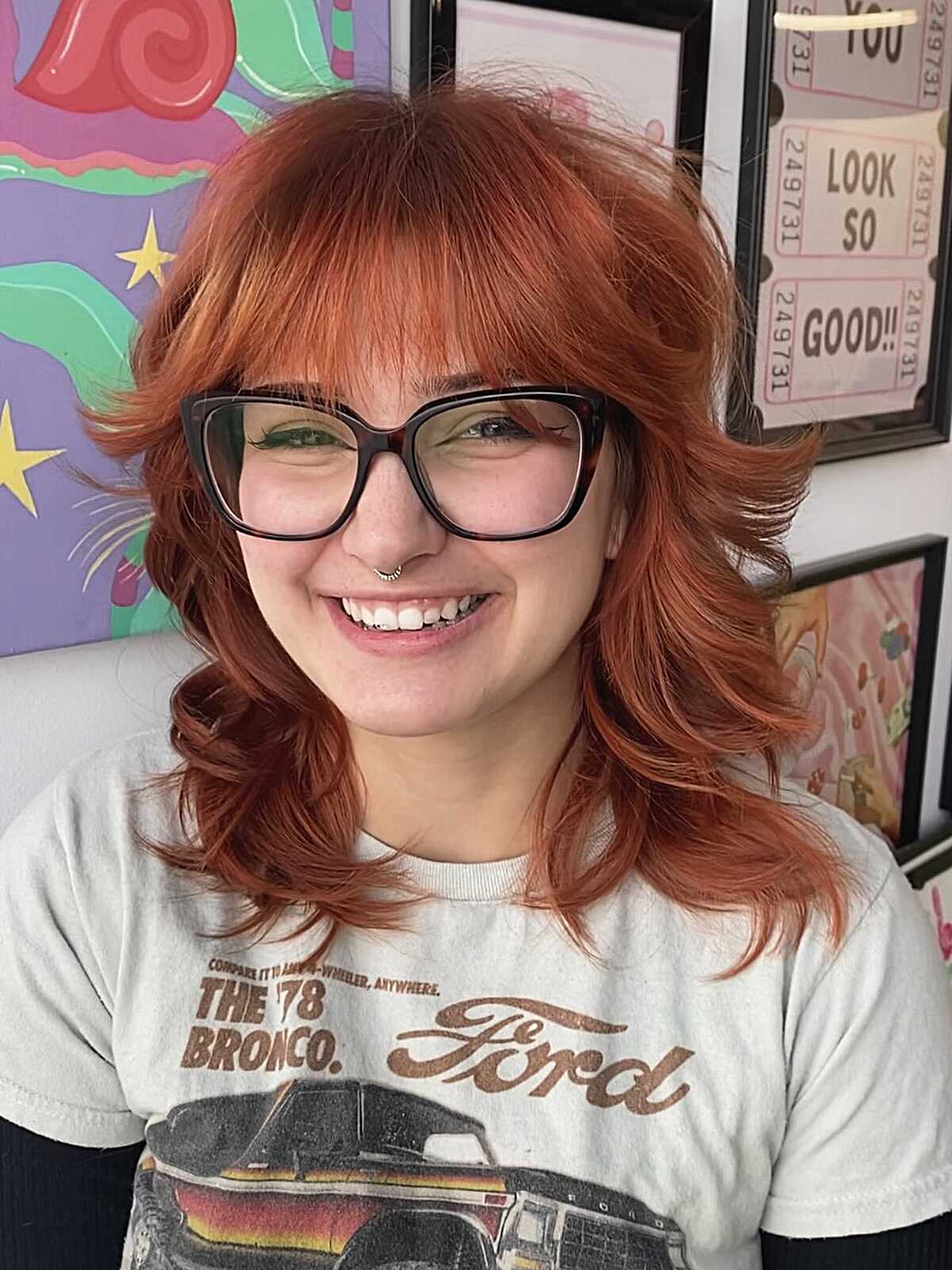 Bright copper shoulder-length shag with retro bangs