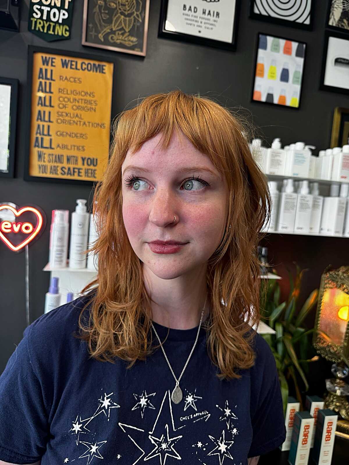 Copper red shoulder-length shag with soft bangs