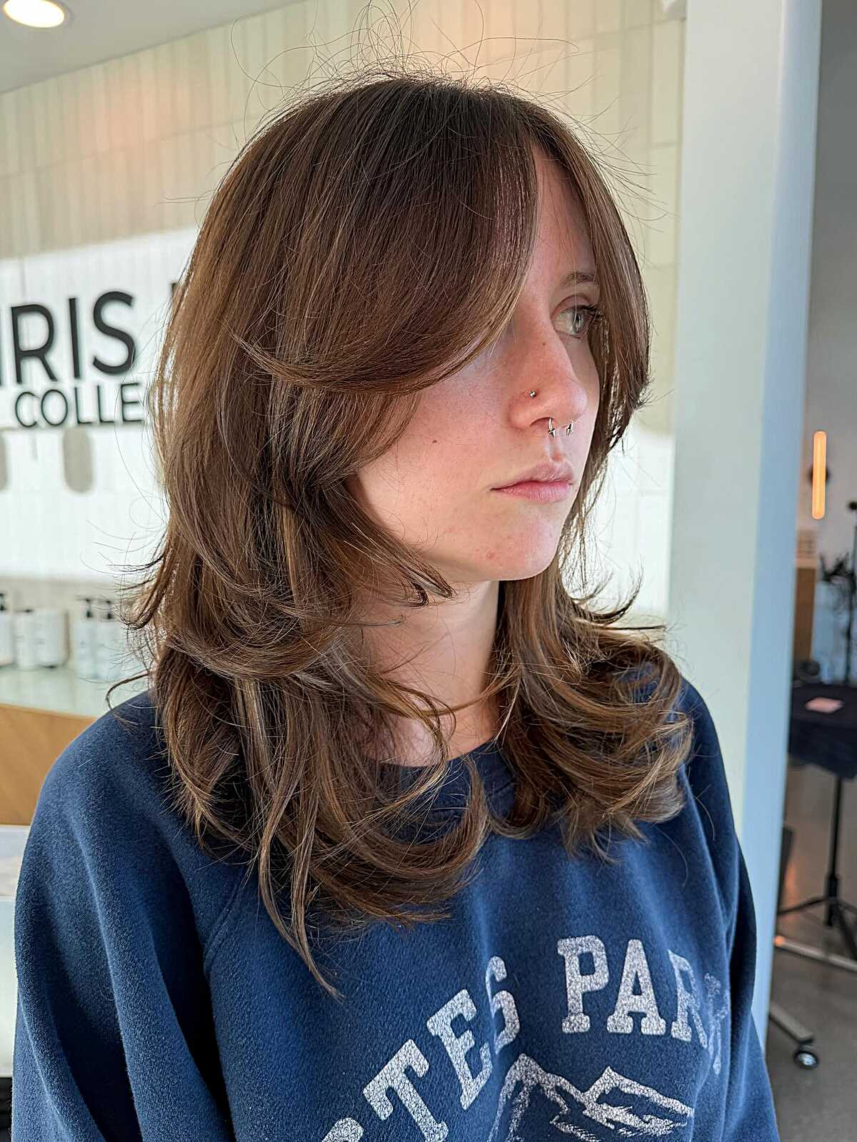 Medium brunette feathered blowout shag with curtain bangs