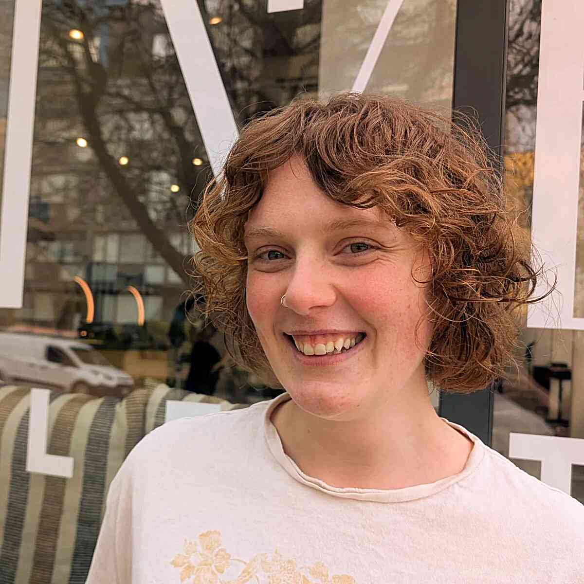 Playful Curly Bob with Curtain Bangs