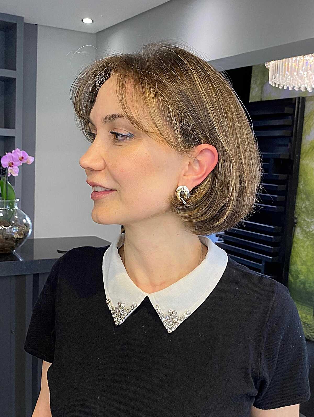 Polished sandy blonde chin bob with soft side part