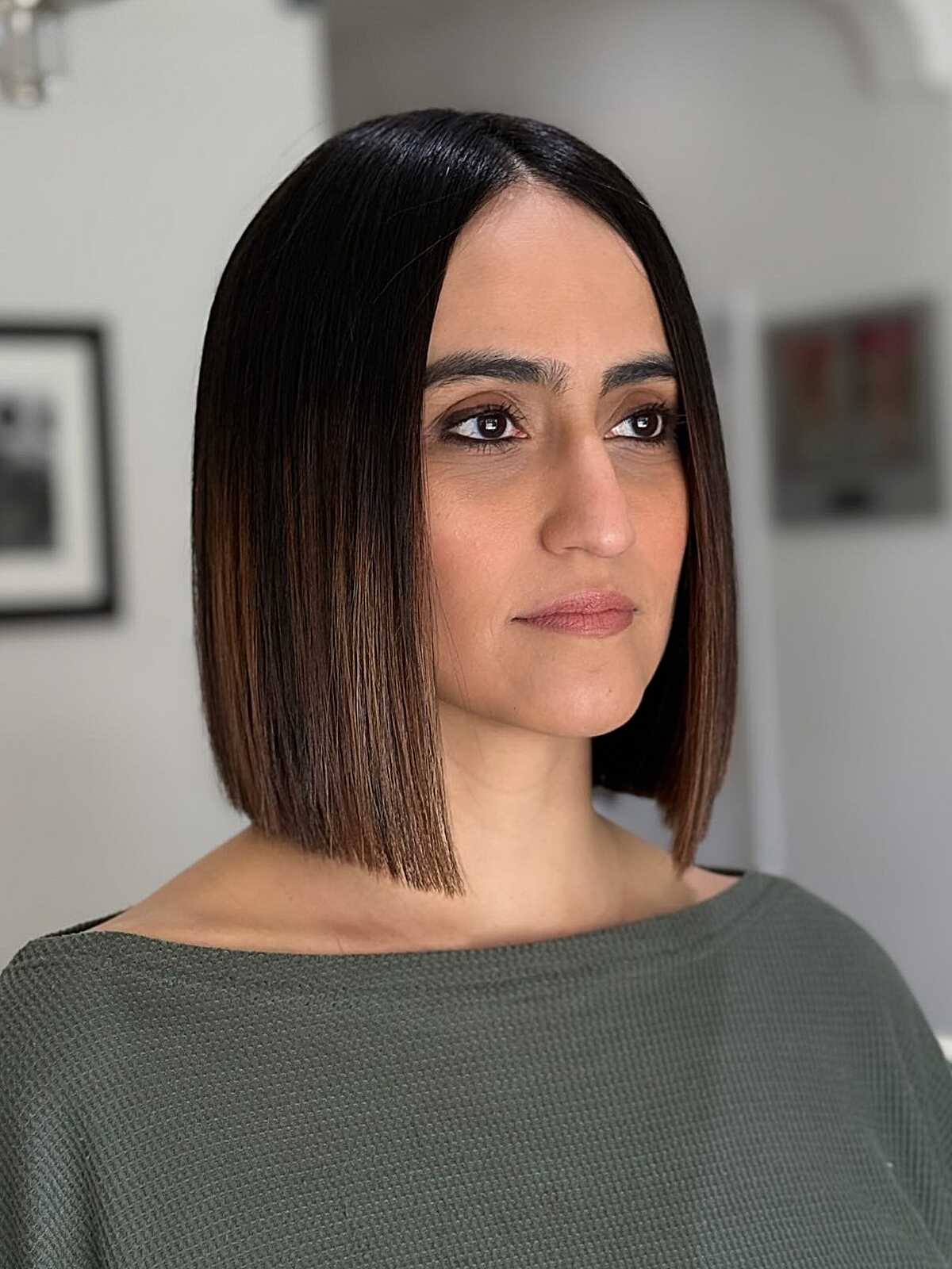 Sleek dark brunette blunt bob at jaw length