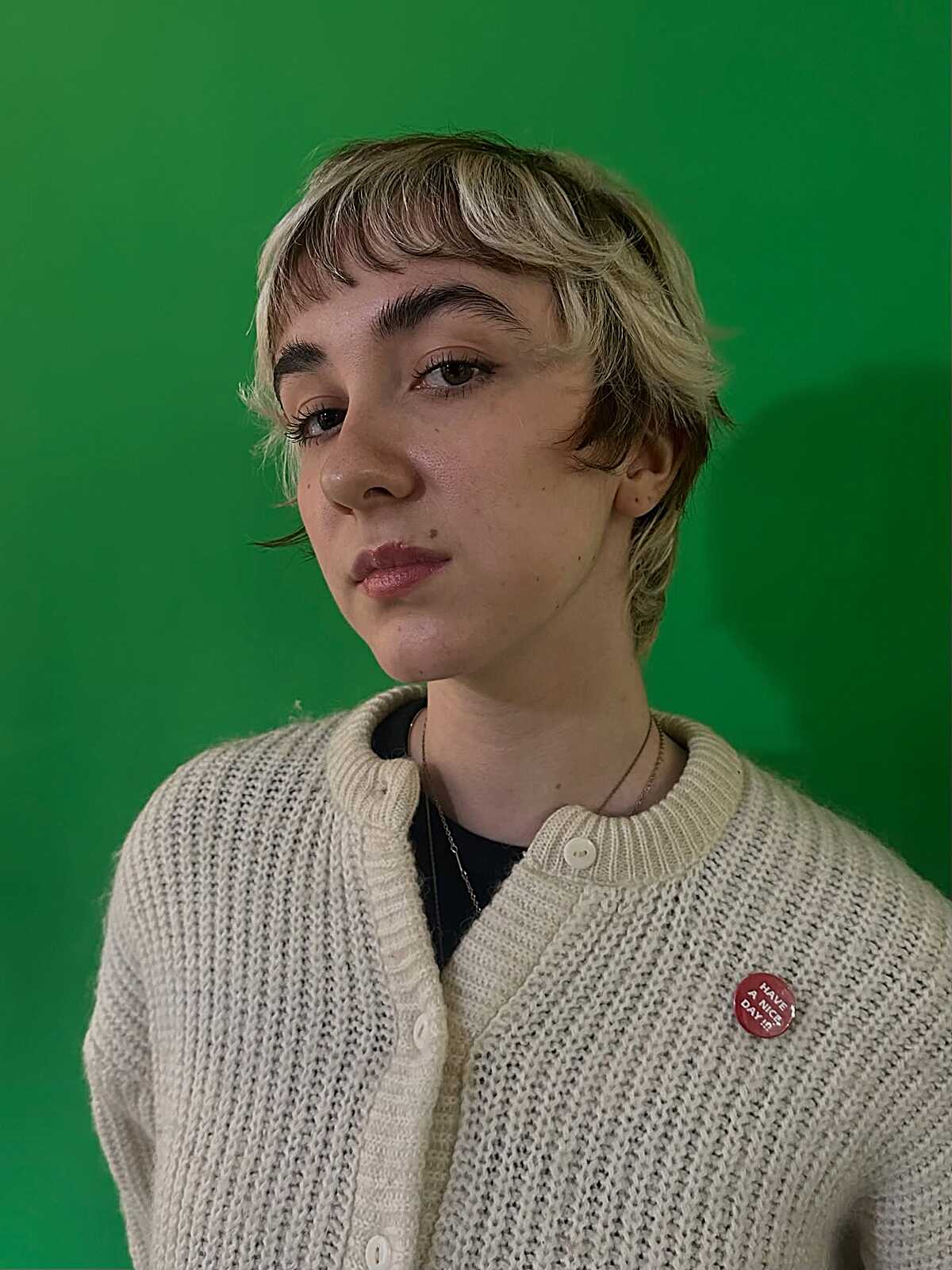 Short shaggy blonde mullet with choppy bangs