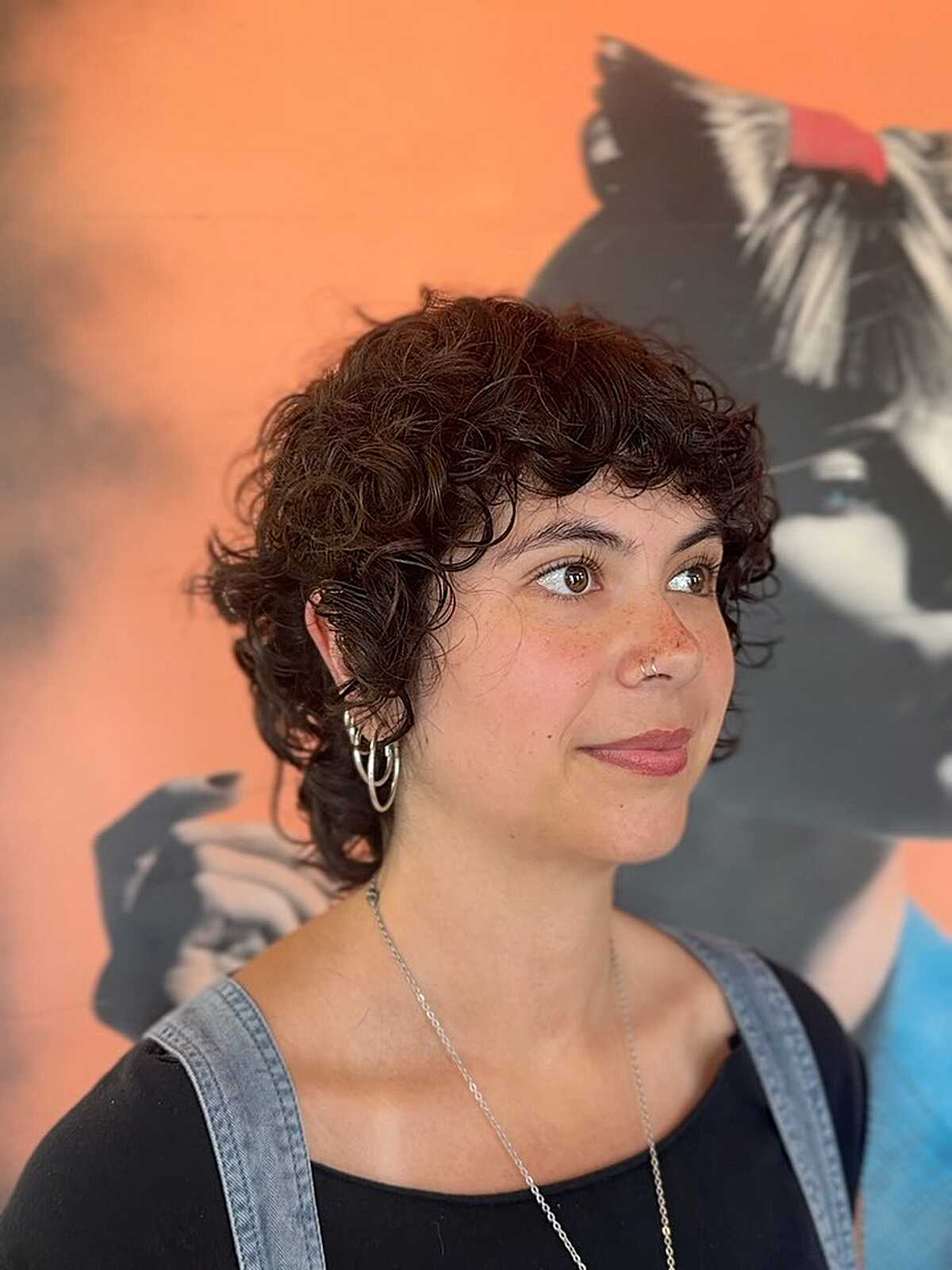 Short dark curly pixie shag with cropped bangs