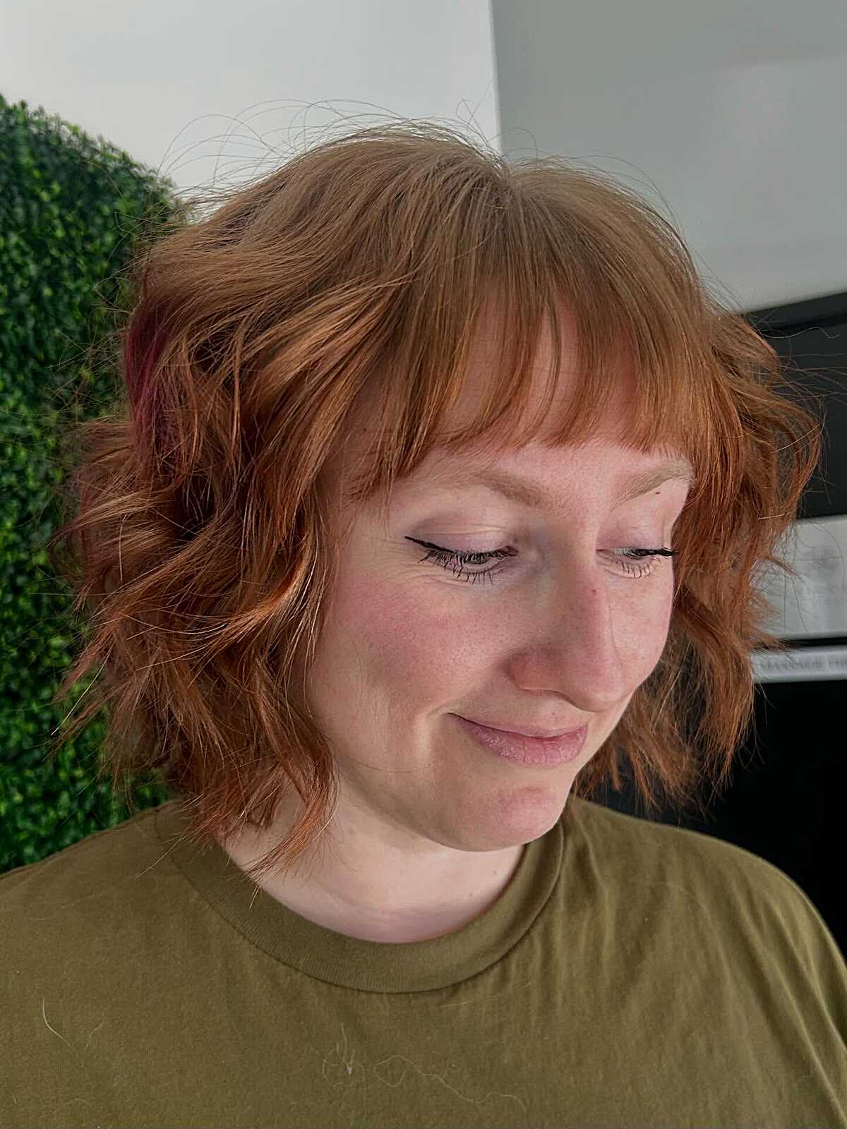 Short tousled ginger bob shag with soft wispy bangs