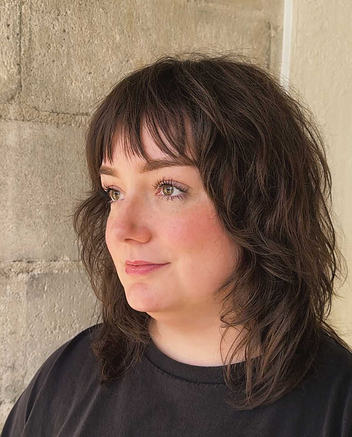 Dark wavy bob-length shag with soft curtain bangs