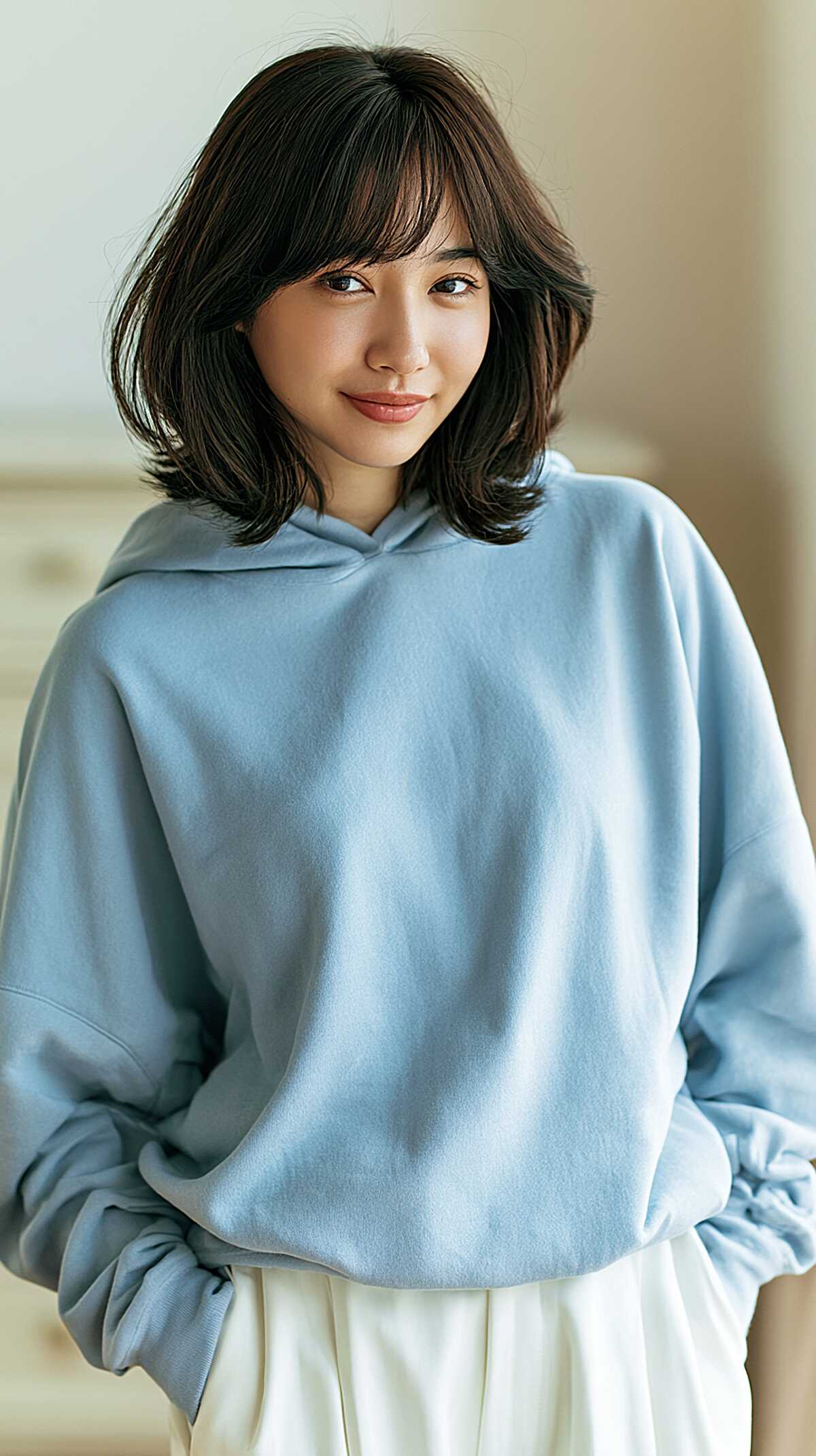 Soft dark layered bob with wispy curtain bangs