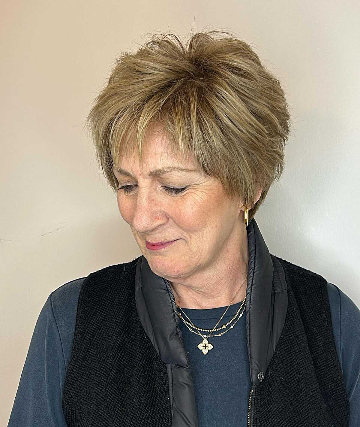 Voluminous ash blonde feathered pixie on older woman