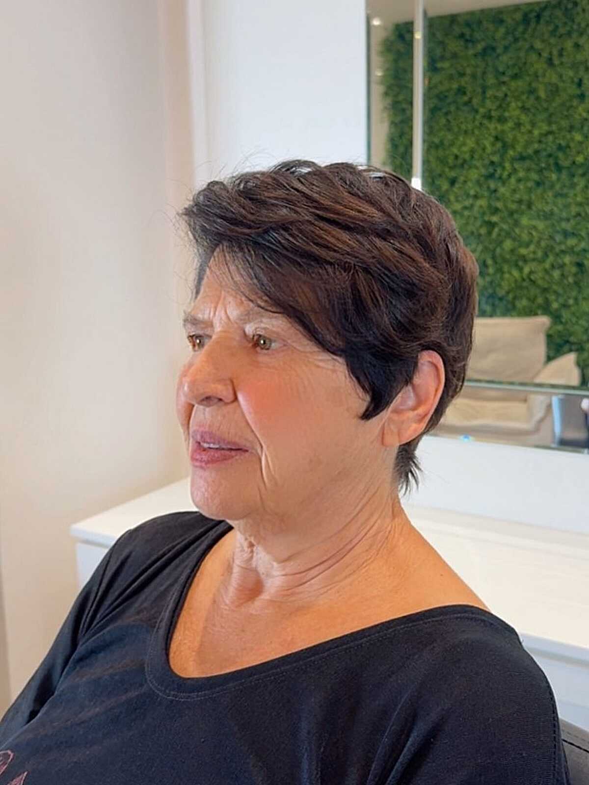 Dark brown layered pixie with wispy nape on grandma